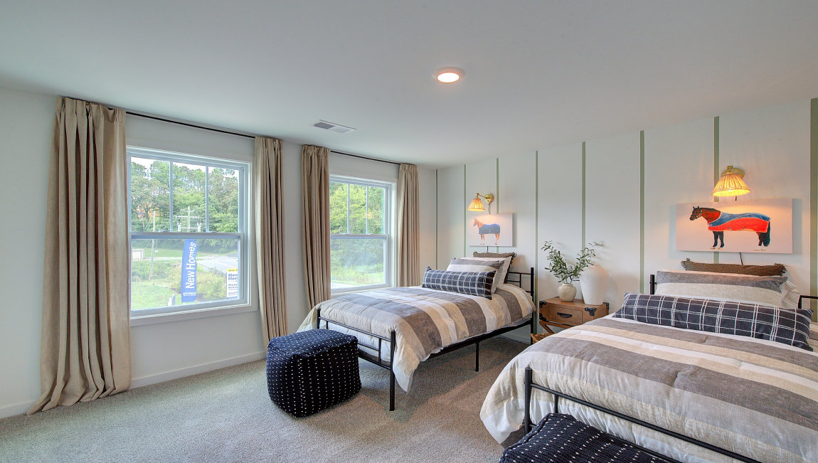 Carpeted bedroom with large windows