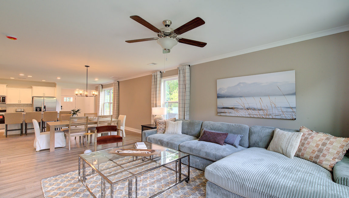 Family room with multiple windows and glass door to back yard