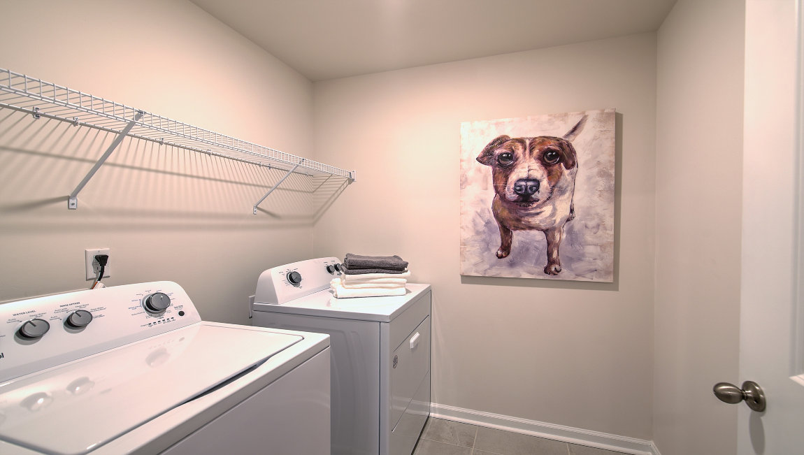 Laundry room with washer, dryer and shelving