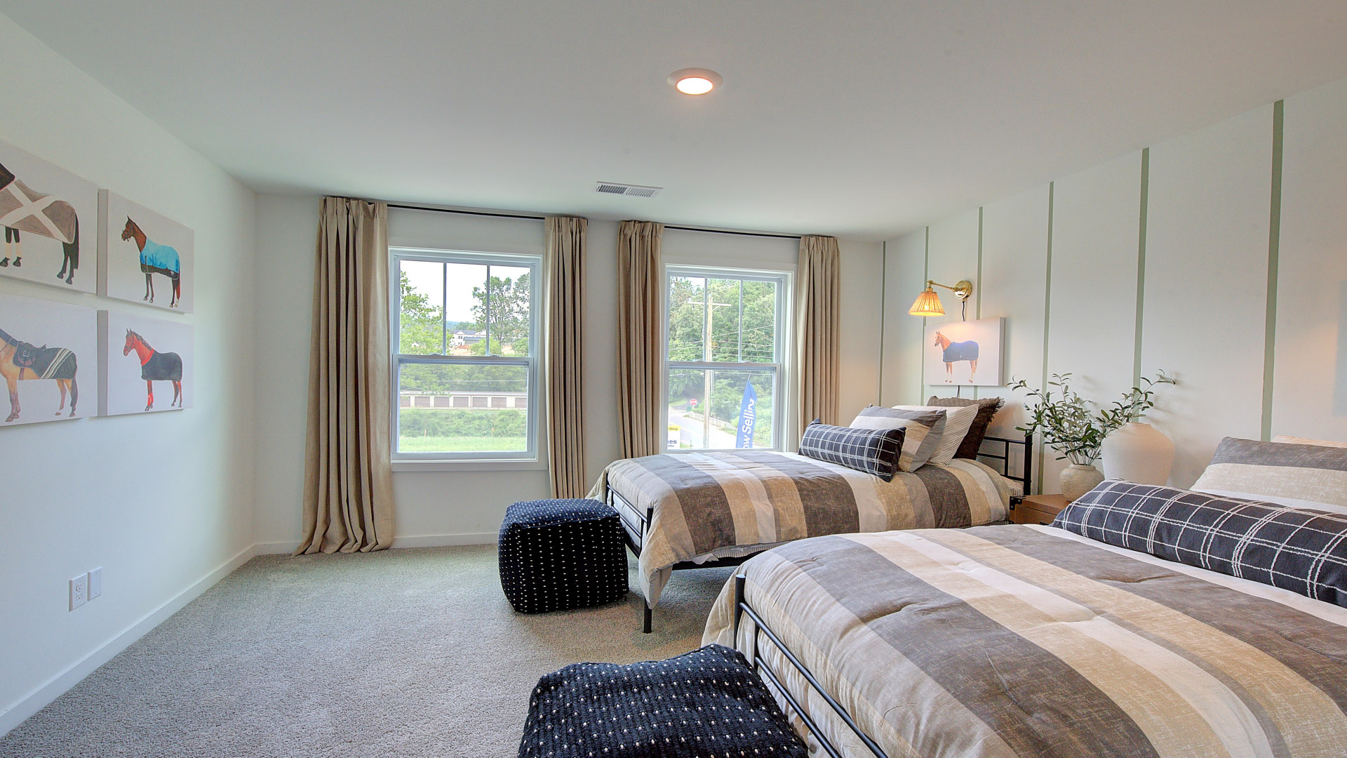 Carpeted bedroom with large windows