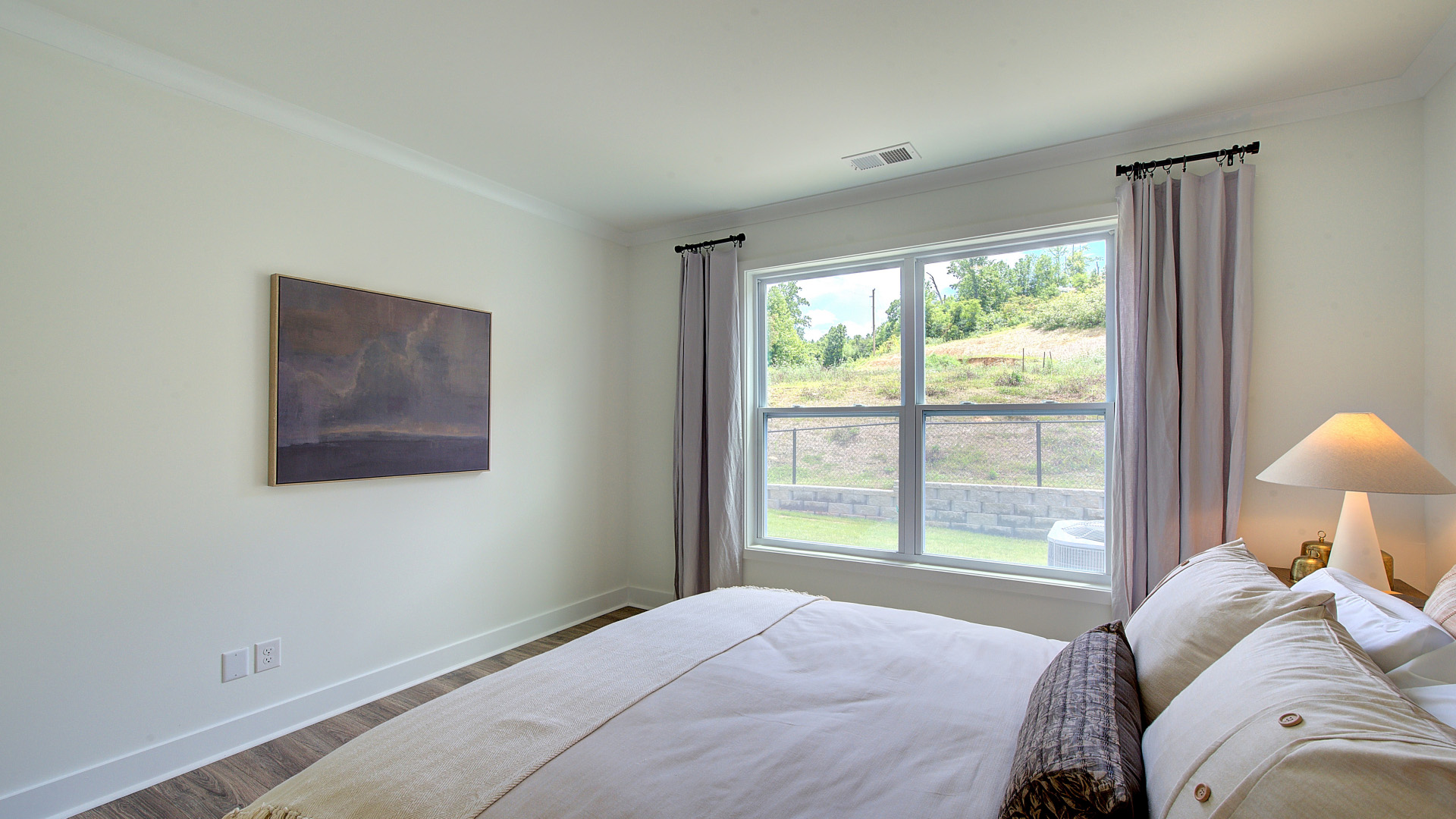First floor bedroom with large windows