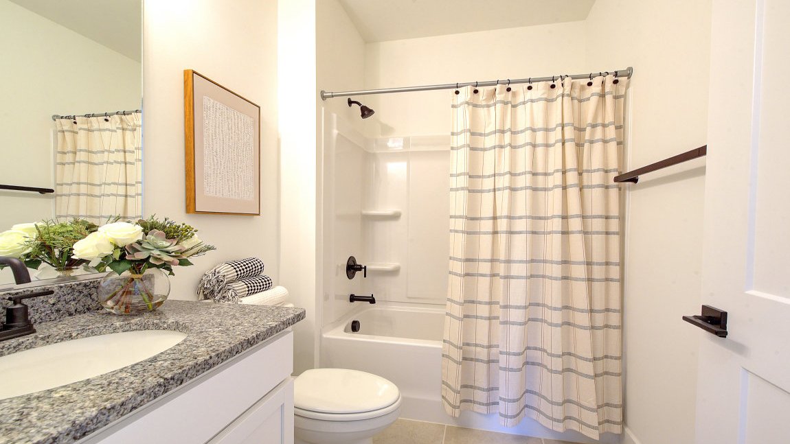 Bathroom with vanity and bathtub