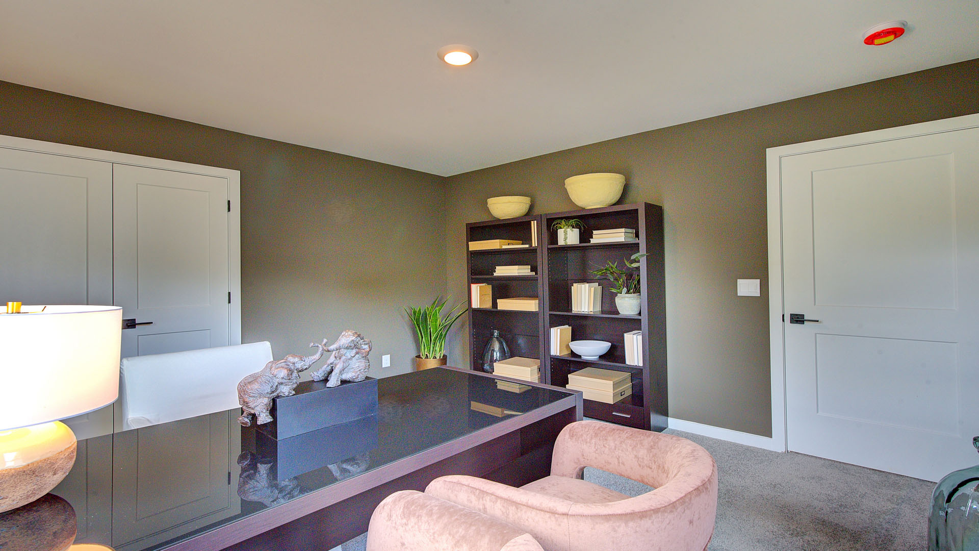 Carpeted bedroom with large windows
