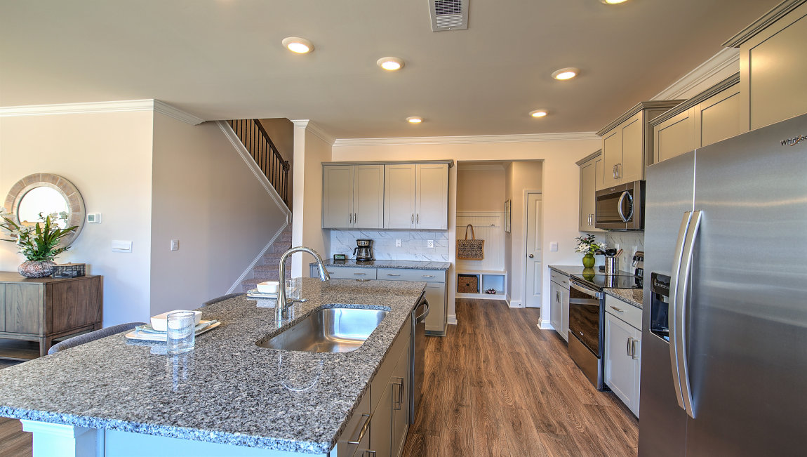 Open concept kitchen with large island and stainless steel appliances