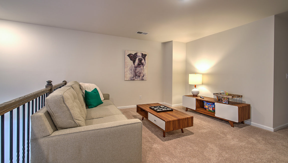 Upstairs living room with carpet