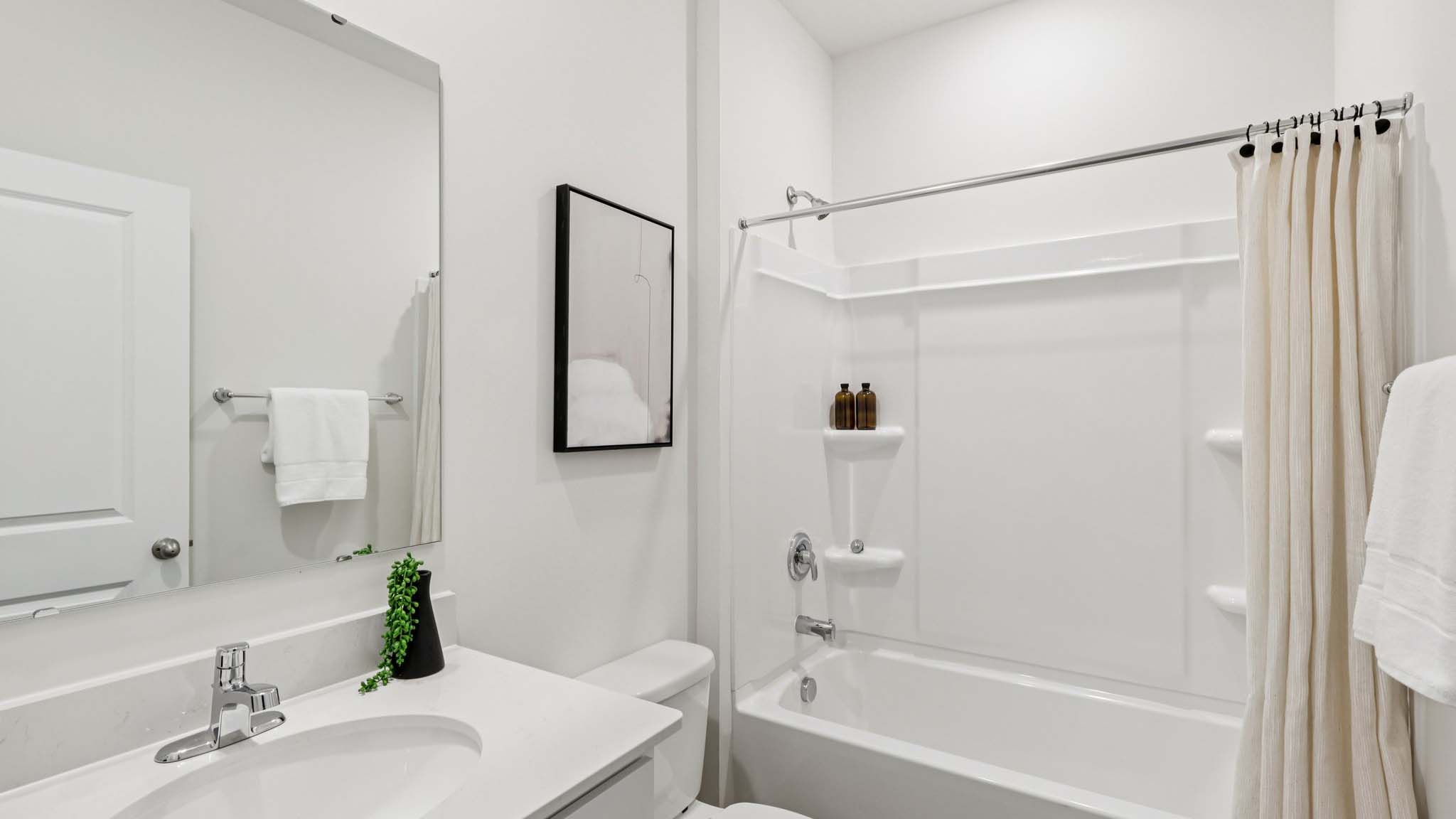 Bathroom with vanity and bathtub