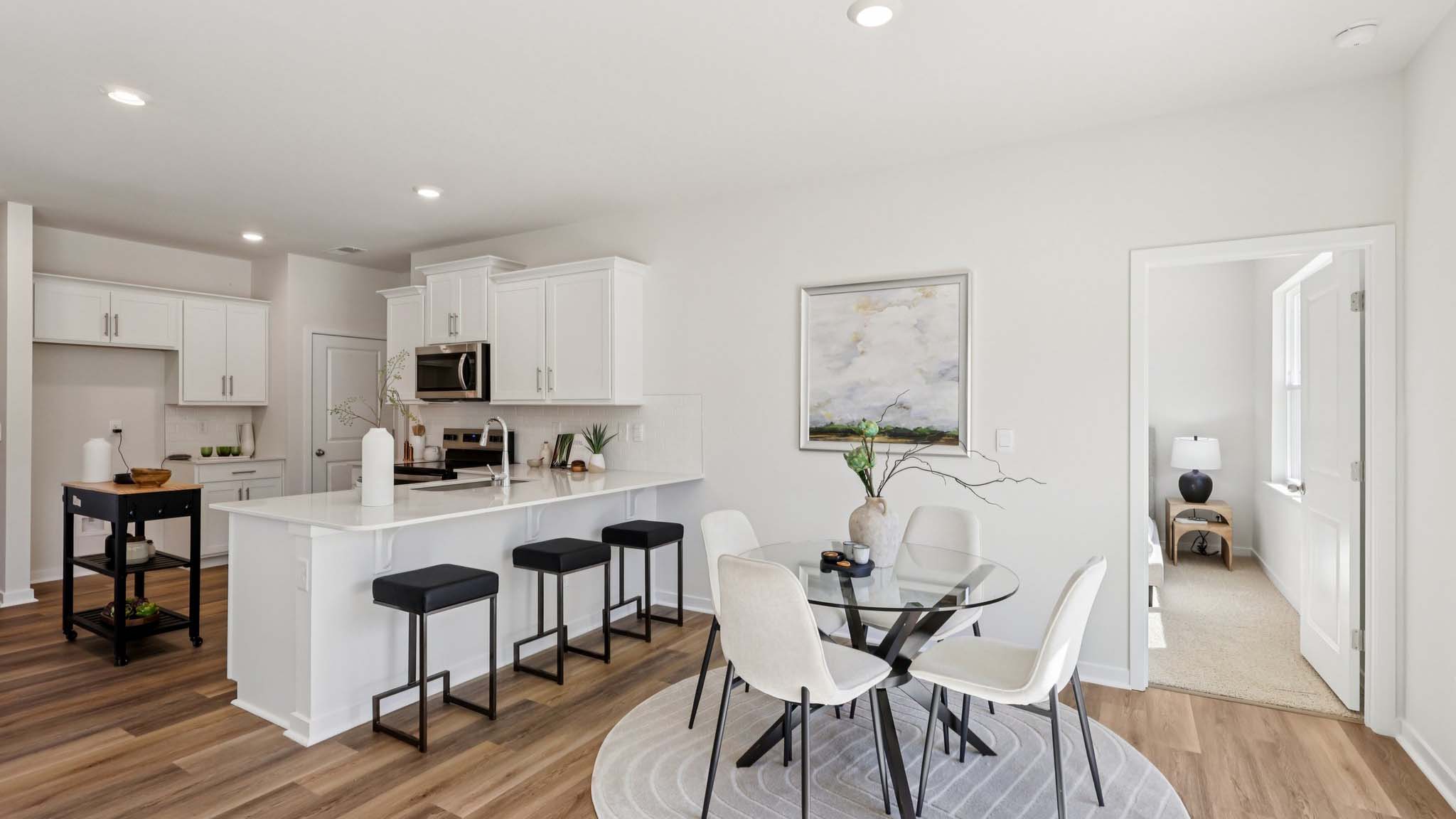 Open concept dining area with sliding glass door to patio