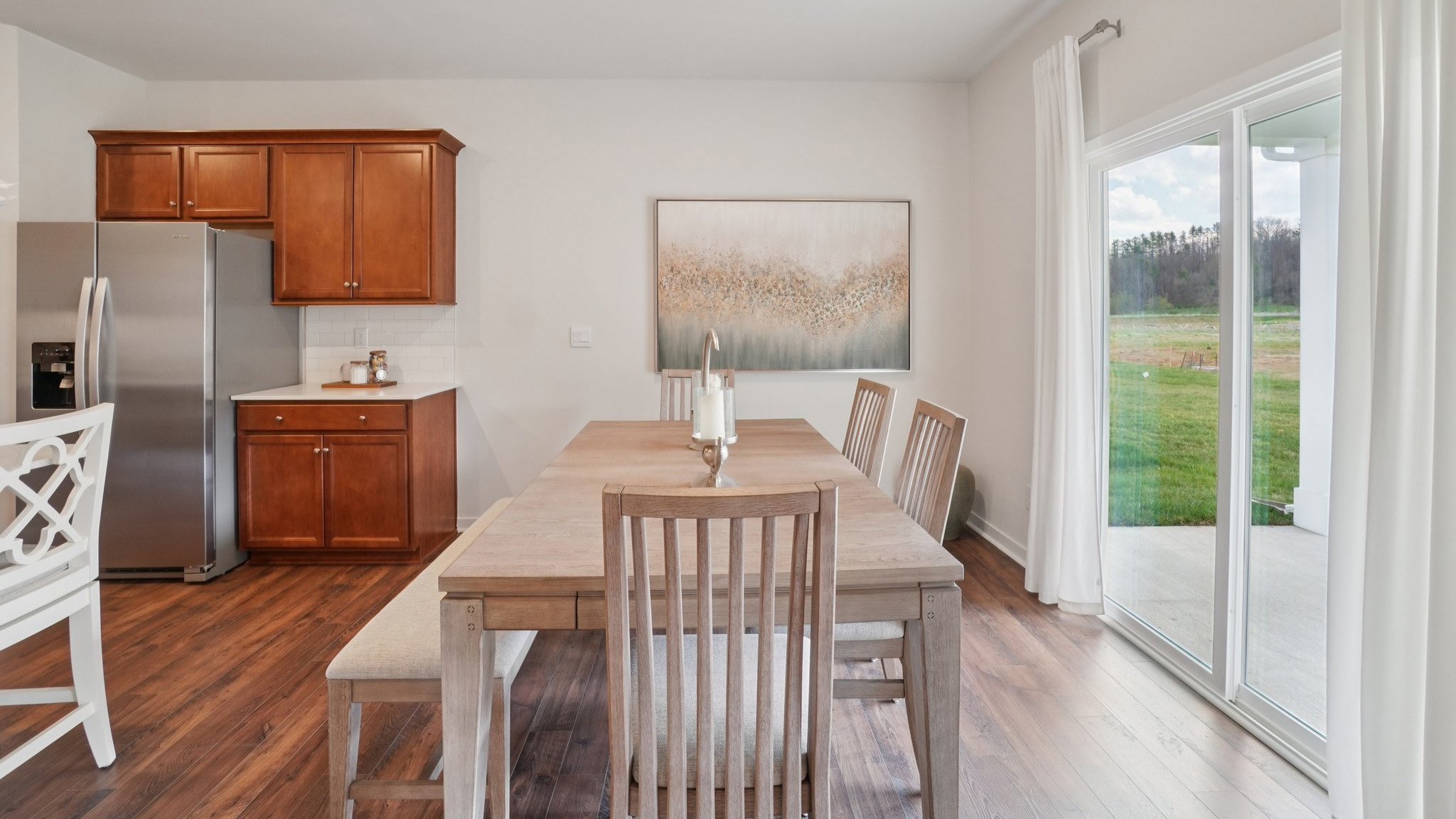 Open concept dining area with sliding glass doors