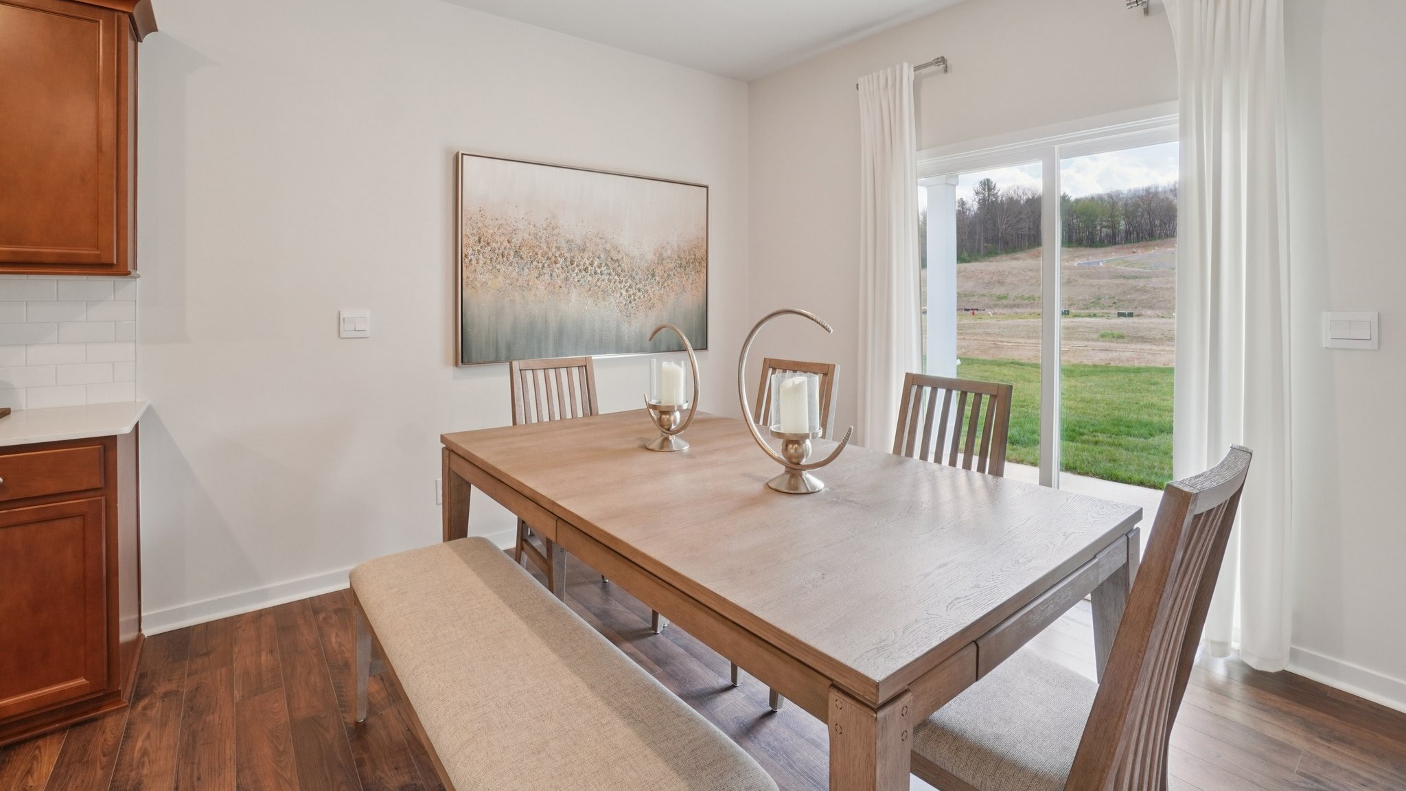 Open concept dining area with sliding glass doors