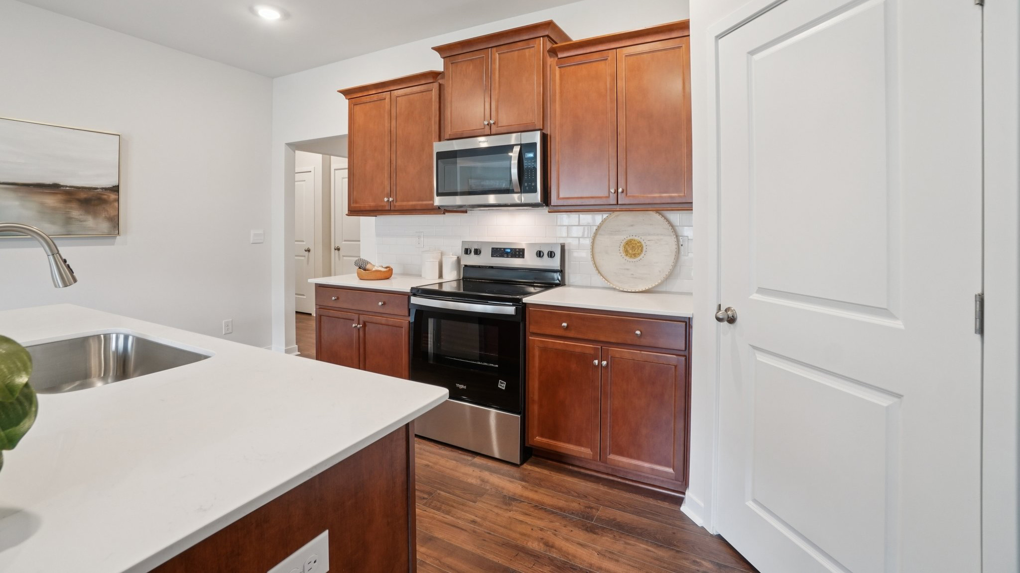 Open concept kitchen with large island and stainless steel appliances