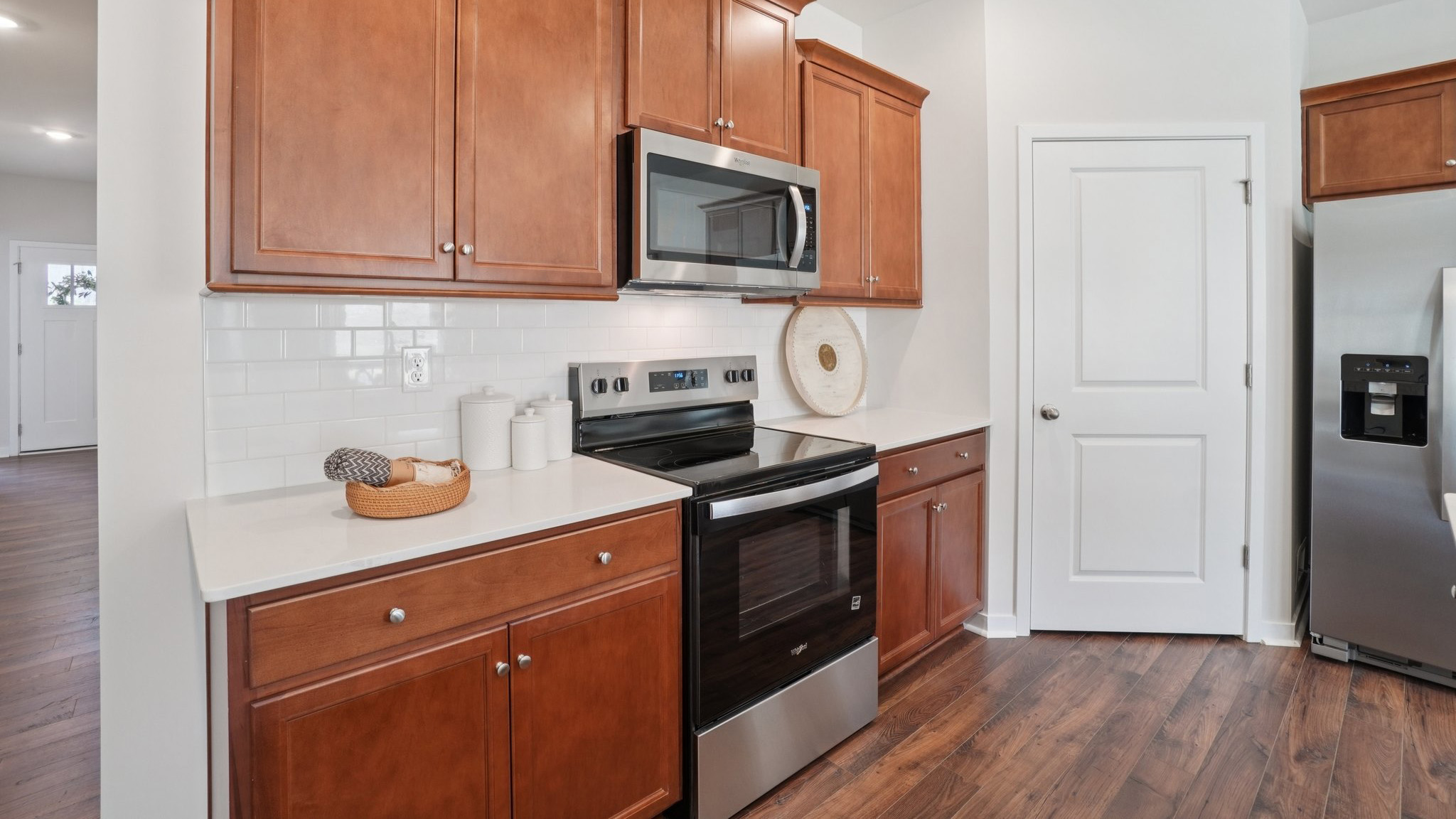 Open concept kitchen with large island and stainless steel appliances