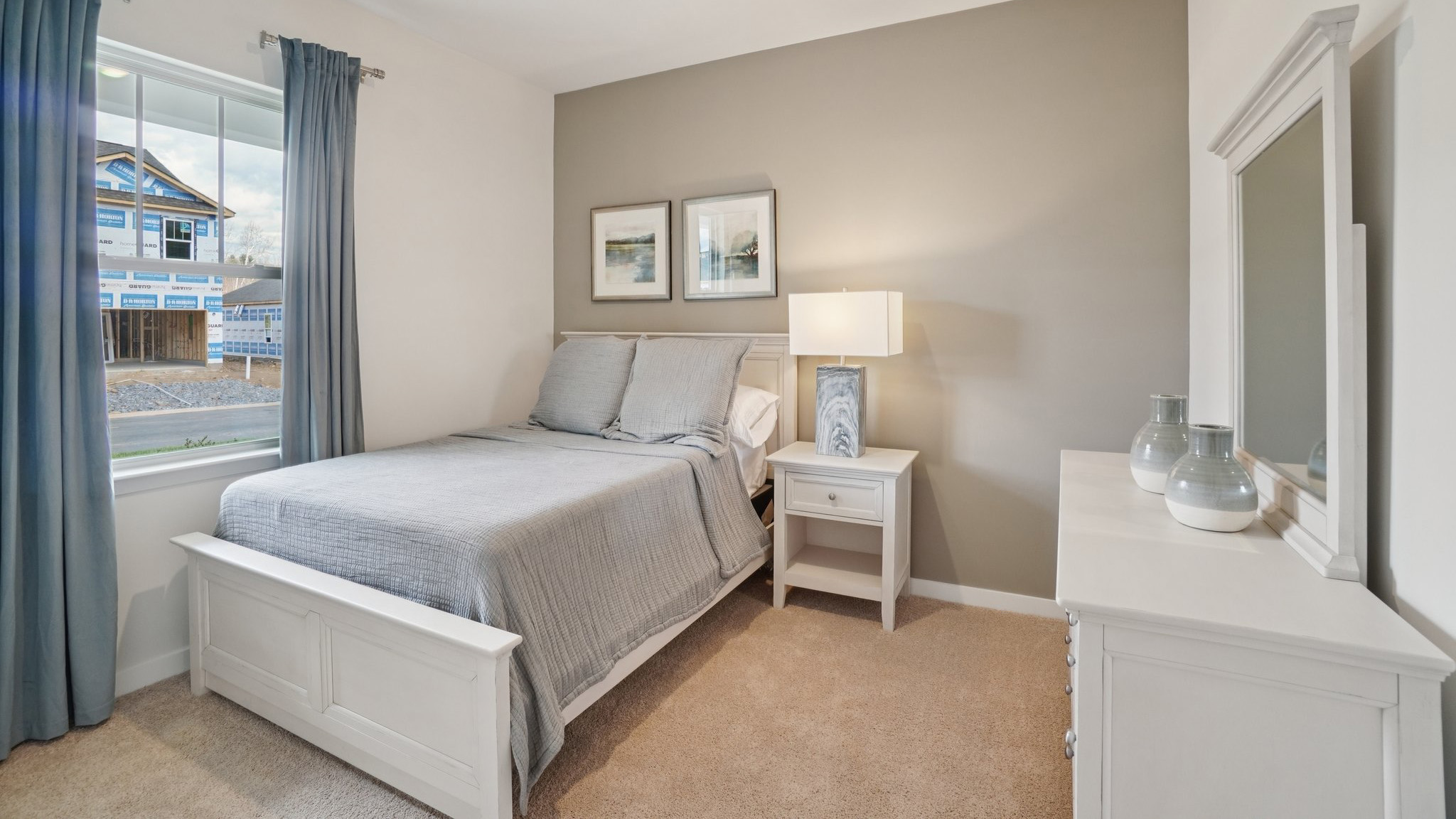 Carpeted bedroom with large window