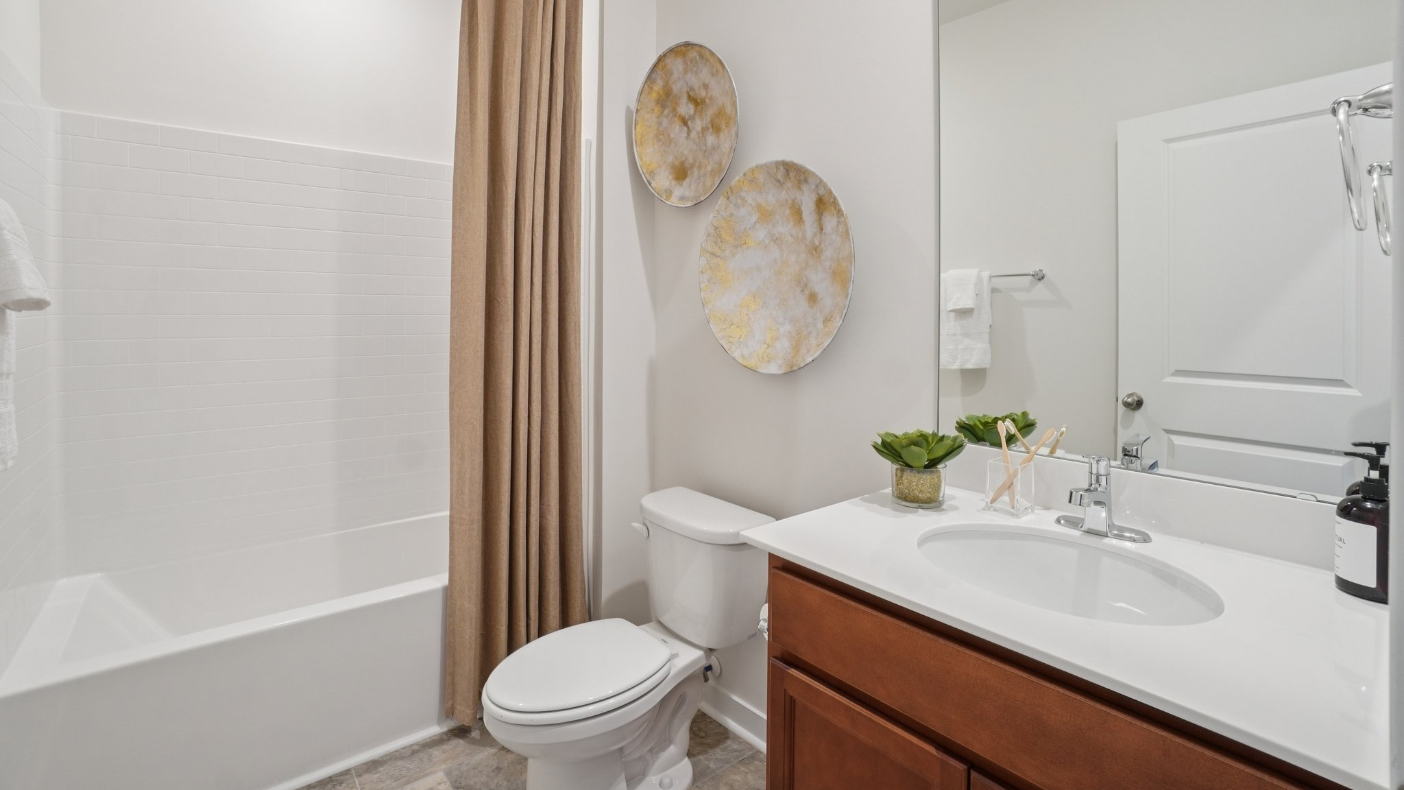 Bathroom with single vanity and bathtub