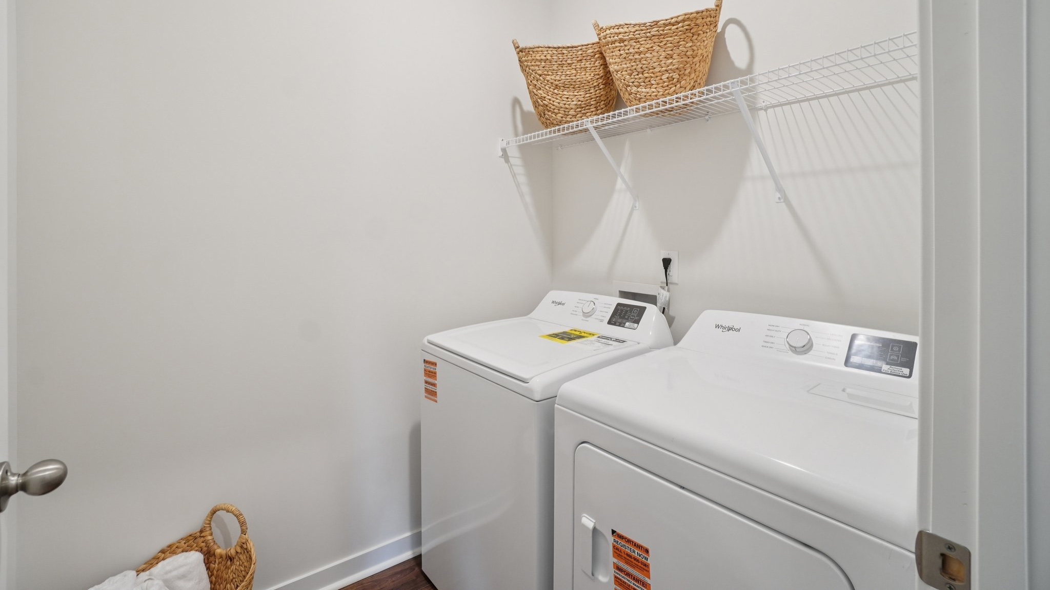 Laundry room with washer, dryer and shelving