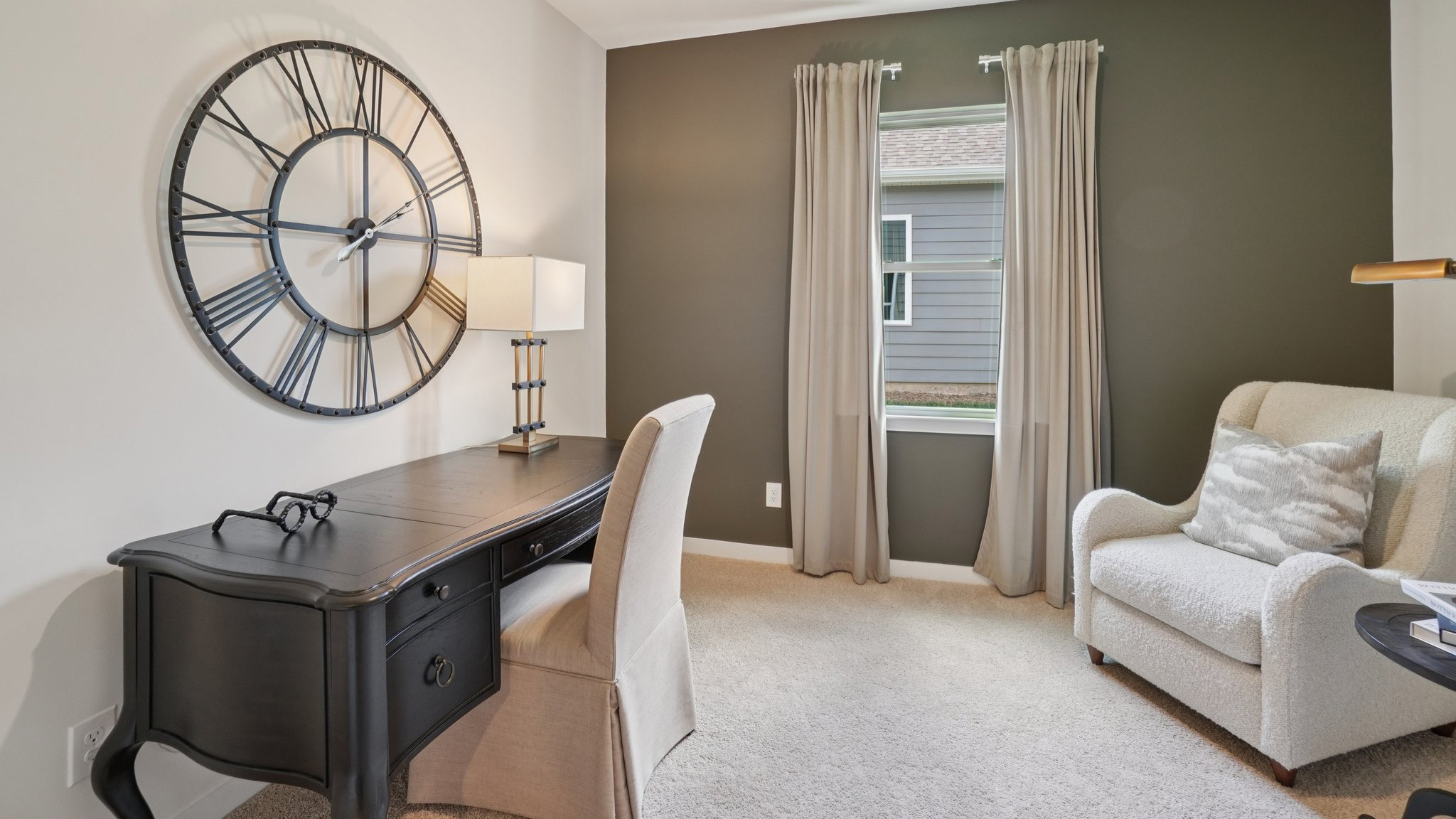 Carpeted bedroom set as office with large window