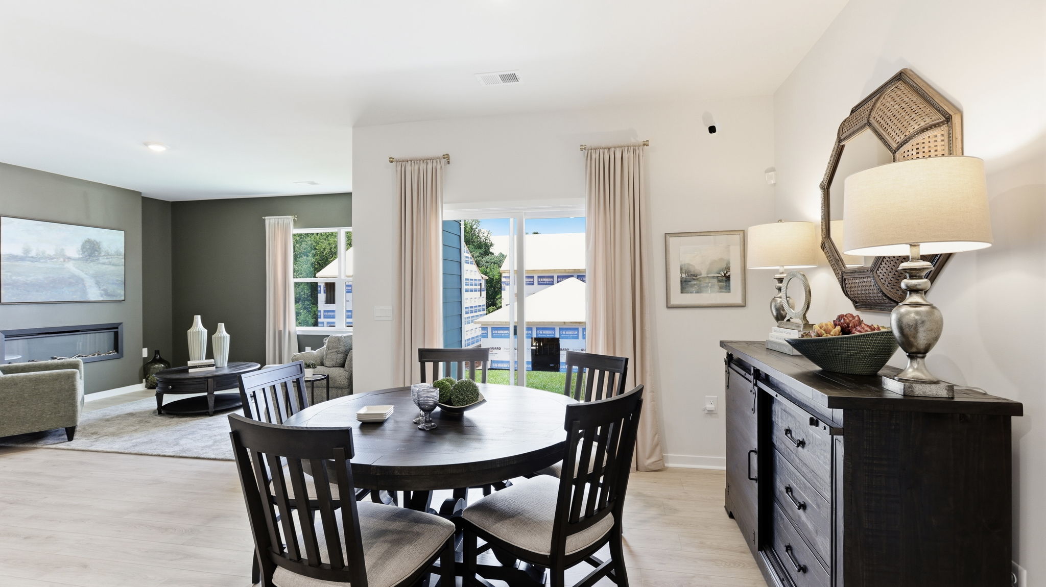 Open dining area with sliding glass door to back patio