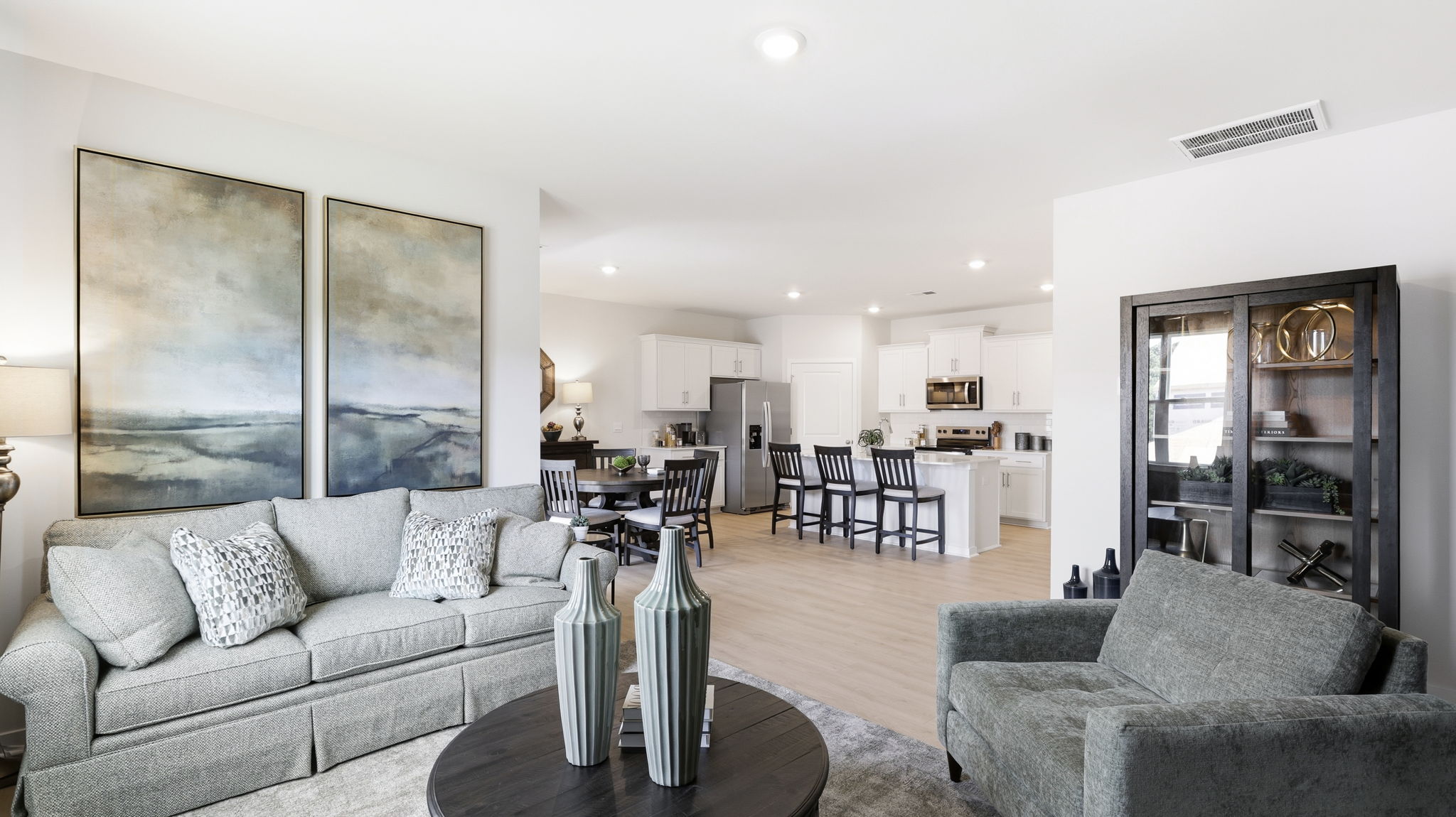 Open living area with large windows and electric fireplace