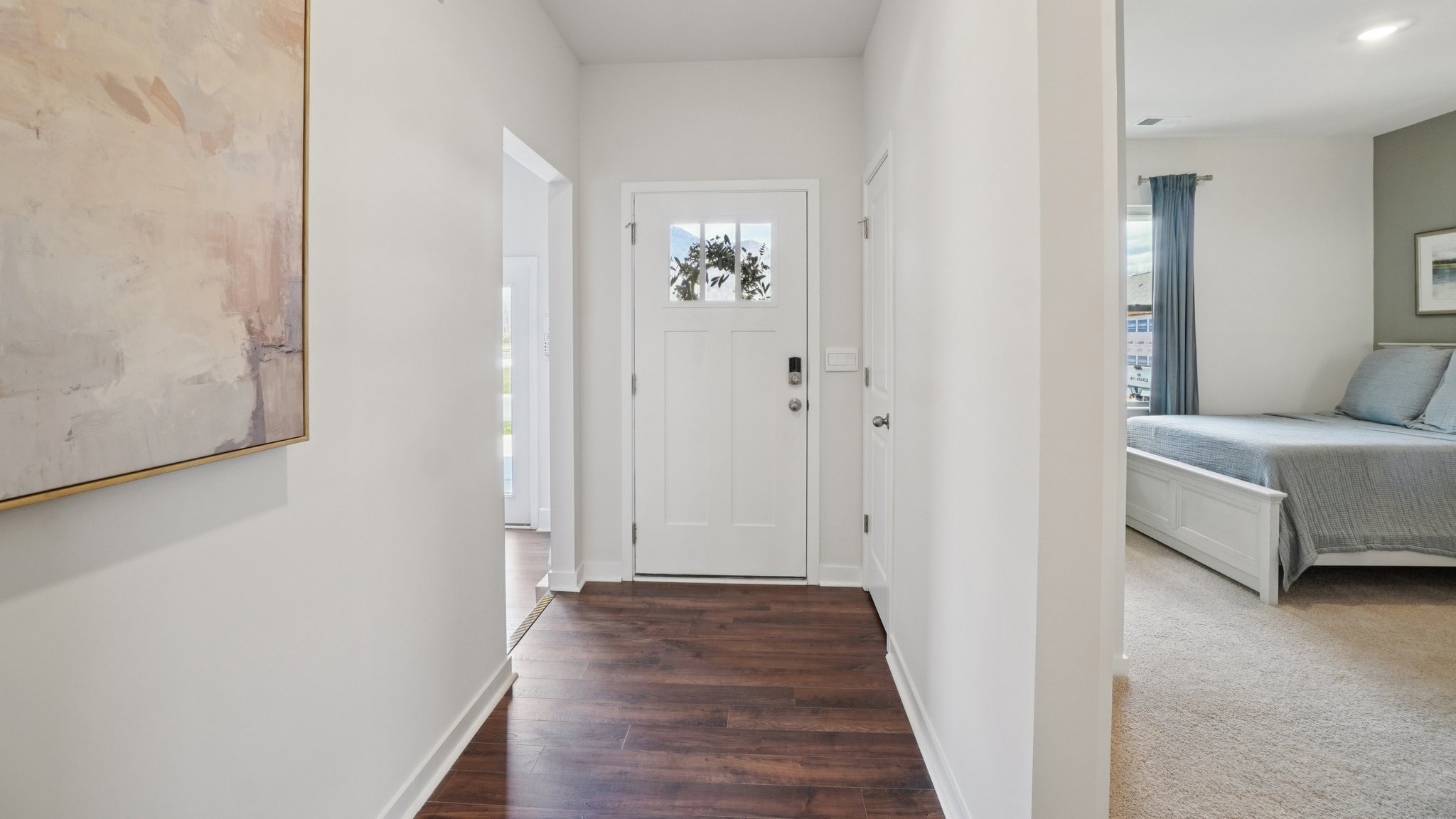 Welcoming foyer with view of front bedroom