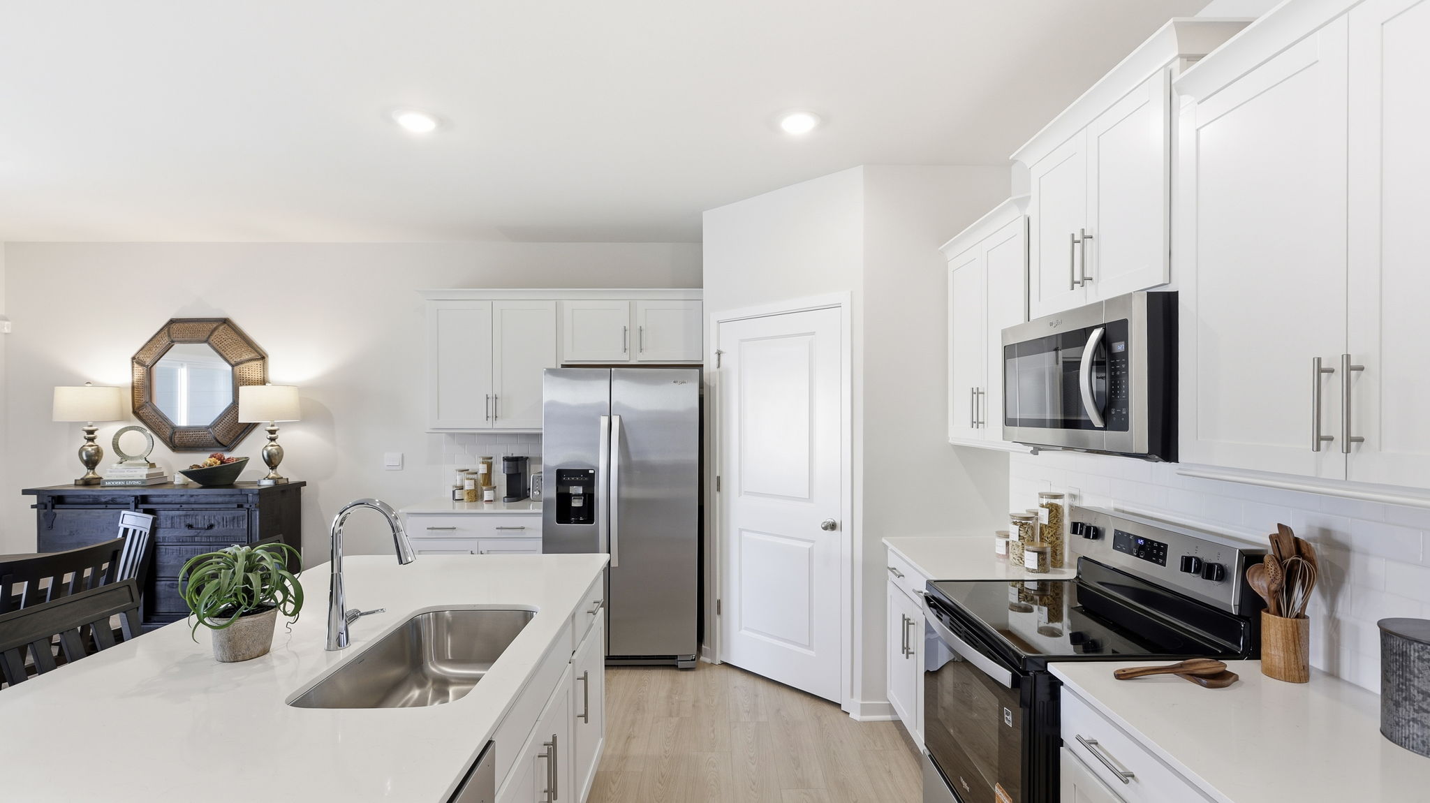 Open concept kitchen with island and stainless-steel appliances
