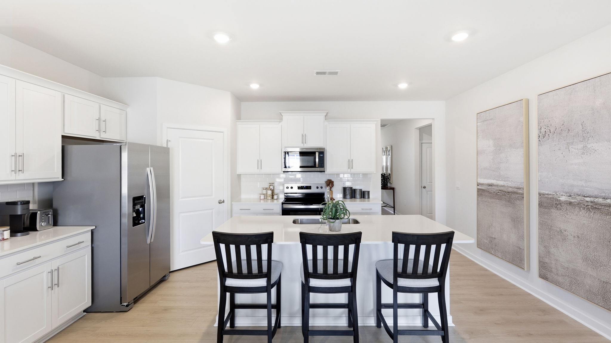 Open concept kitchen with island and stainless-steel appliances