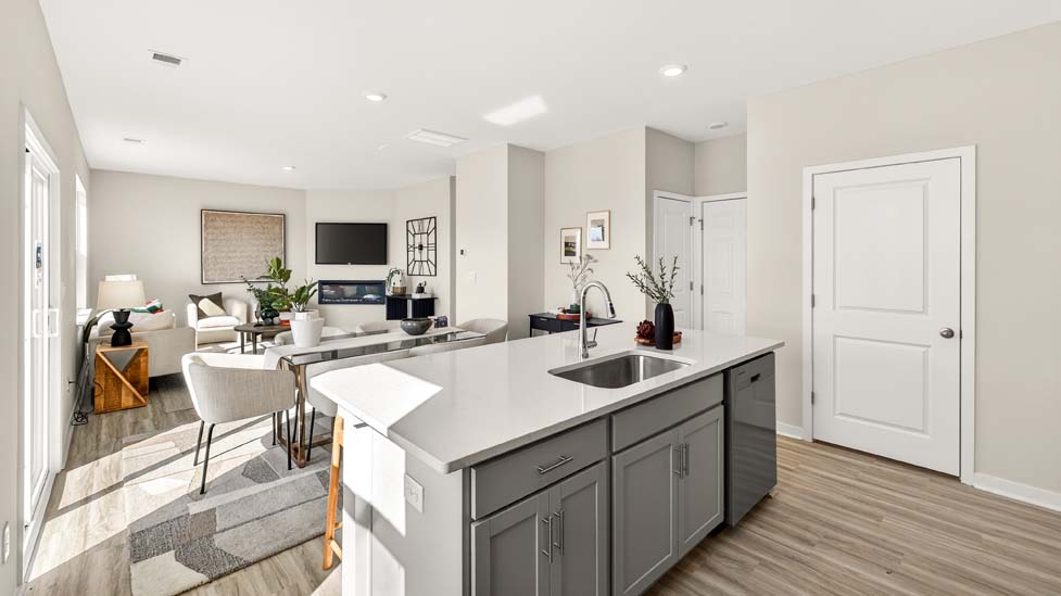 Open concept kitchen with large kitchen island and stainless steel appliances