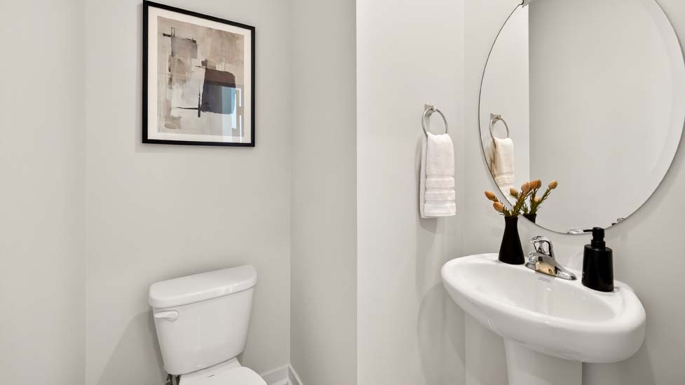 Half bathroom with single sink and mirror