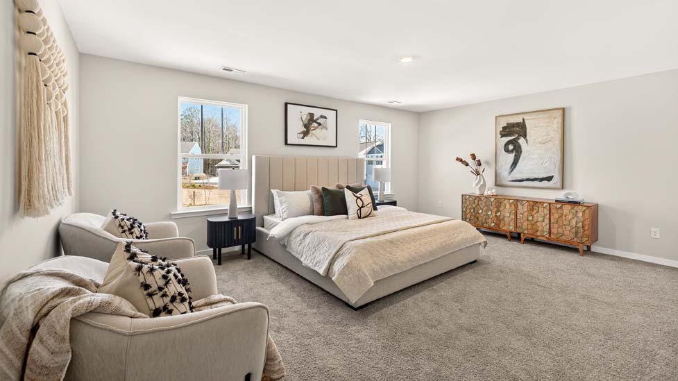 Carpeted primary bedroom with