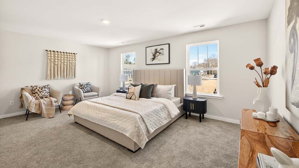 Carpeted primary bedroom with