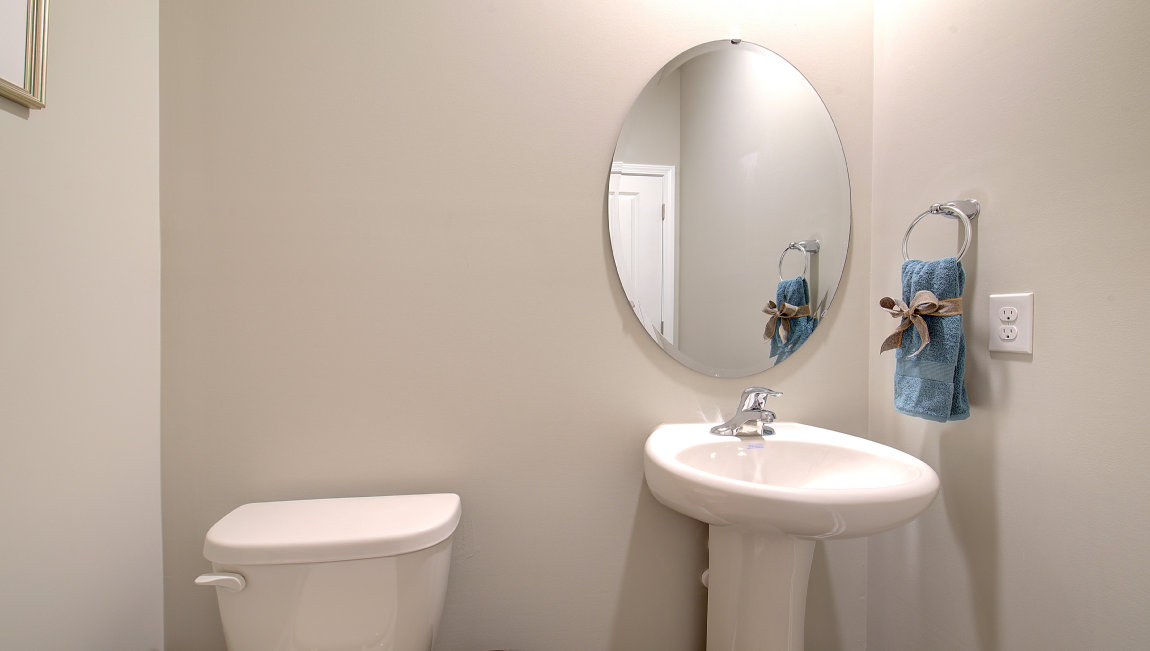 Powder room with single sink and mirror