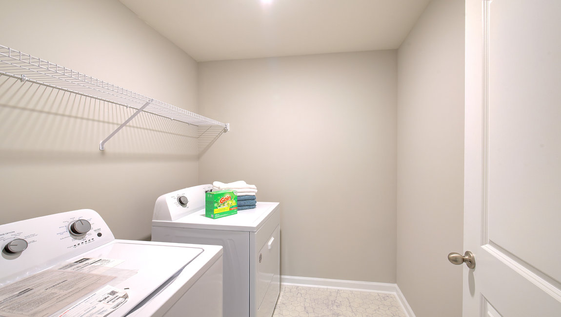 Laundry room with washer, dryer and shelving