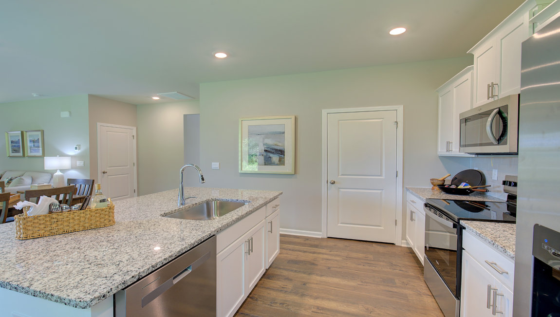 Open concept kitchen with large island and stainless steel appliances