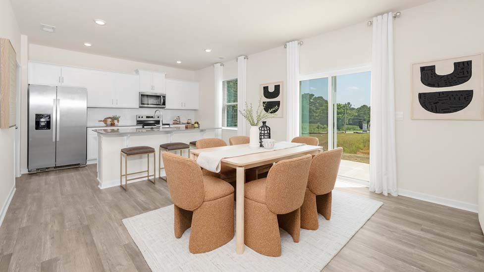 Open dinding area with sliding glass doors to patio