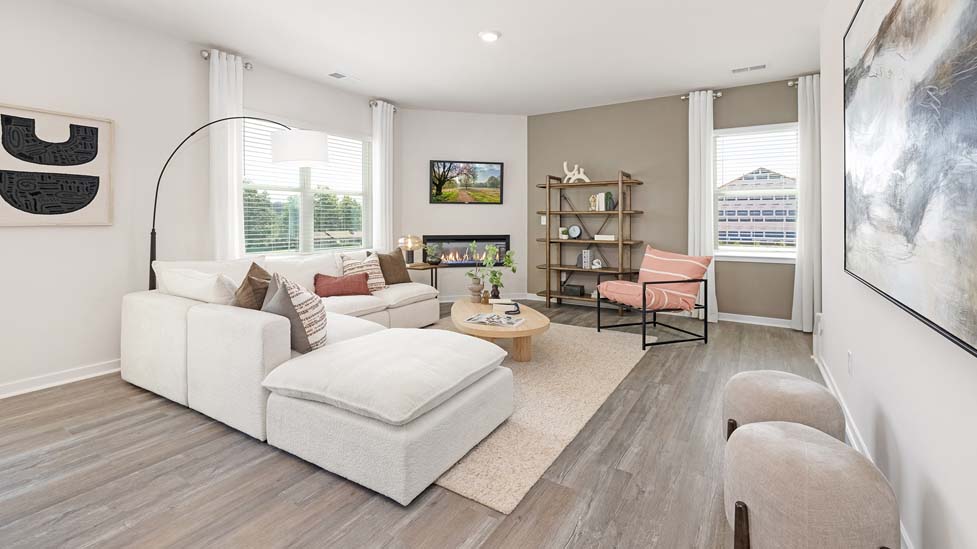 Open concept living area with large windows