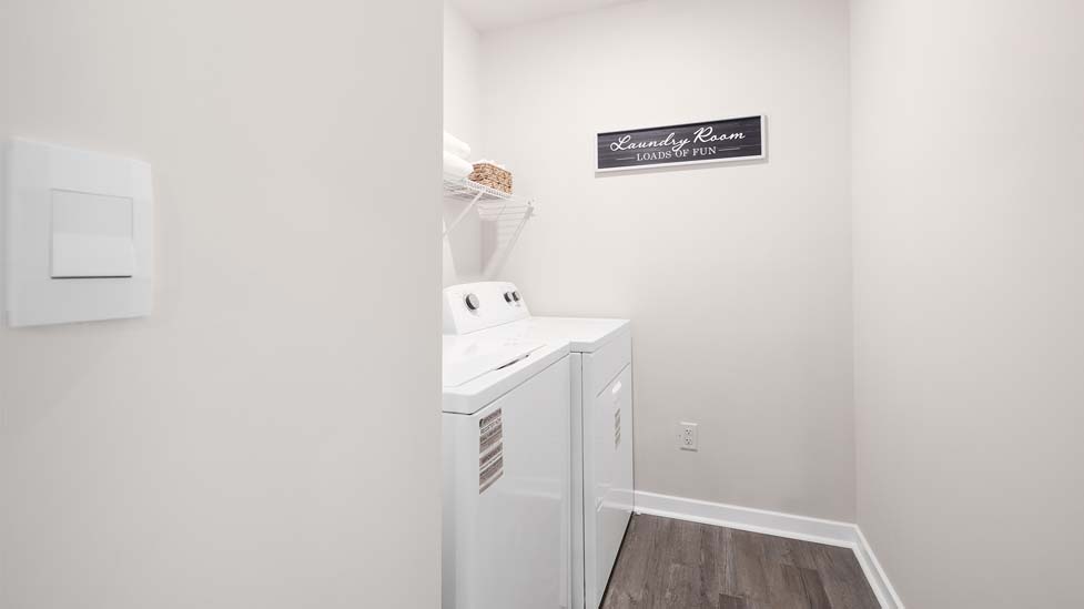 Laundry room with washer, dryer and shelving