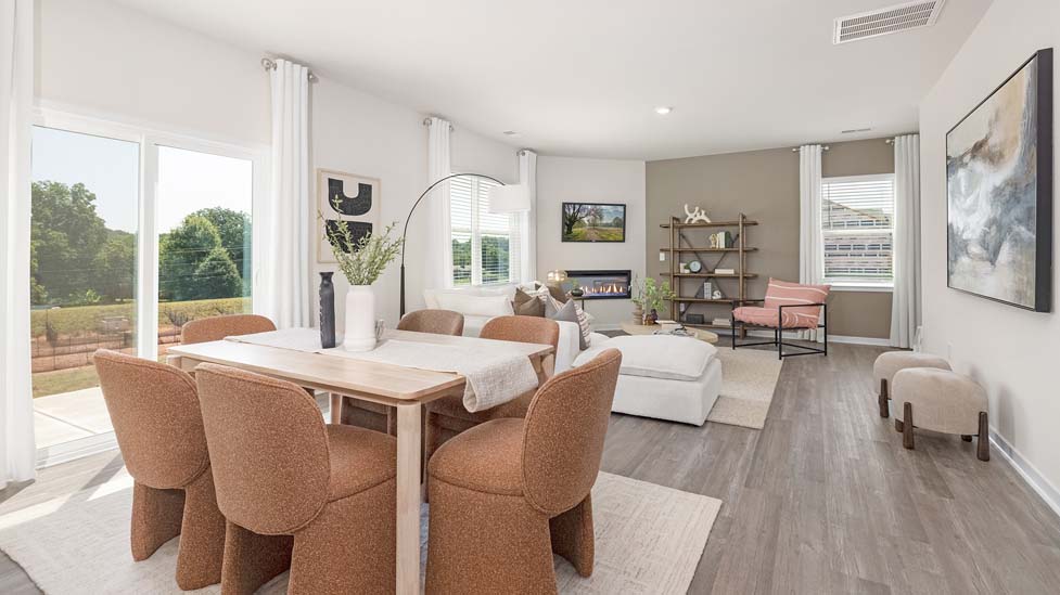 Open dinding area with sliding glass doors to patio