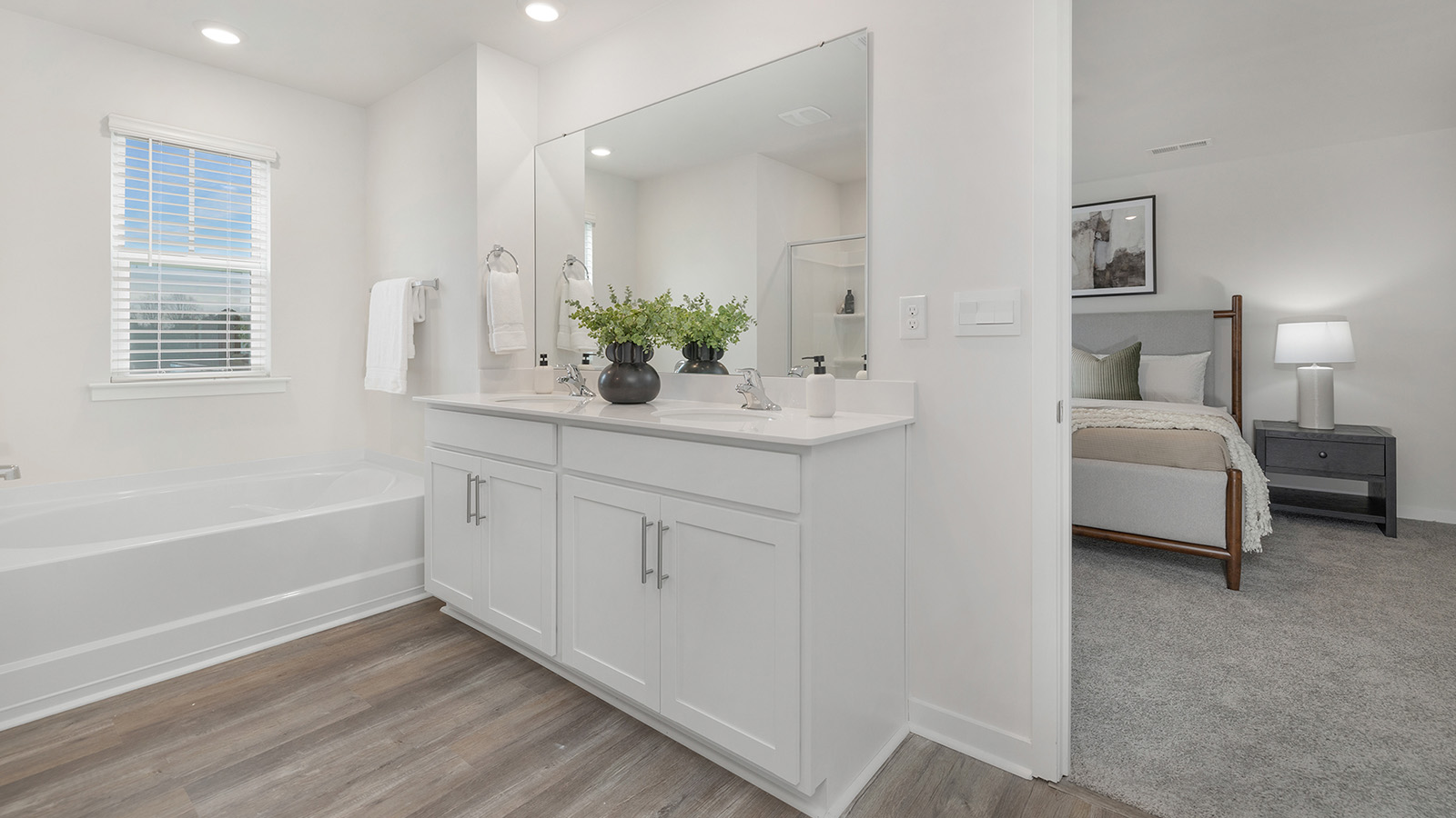 Primary bathroom with dual vanity and mirror