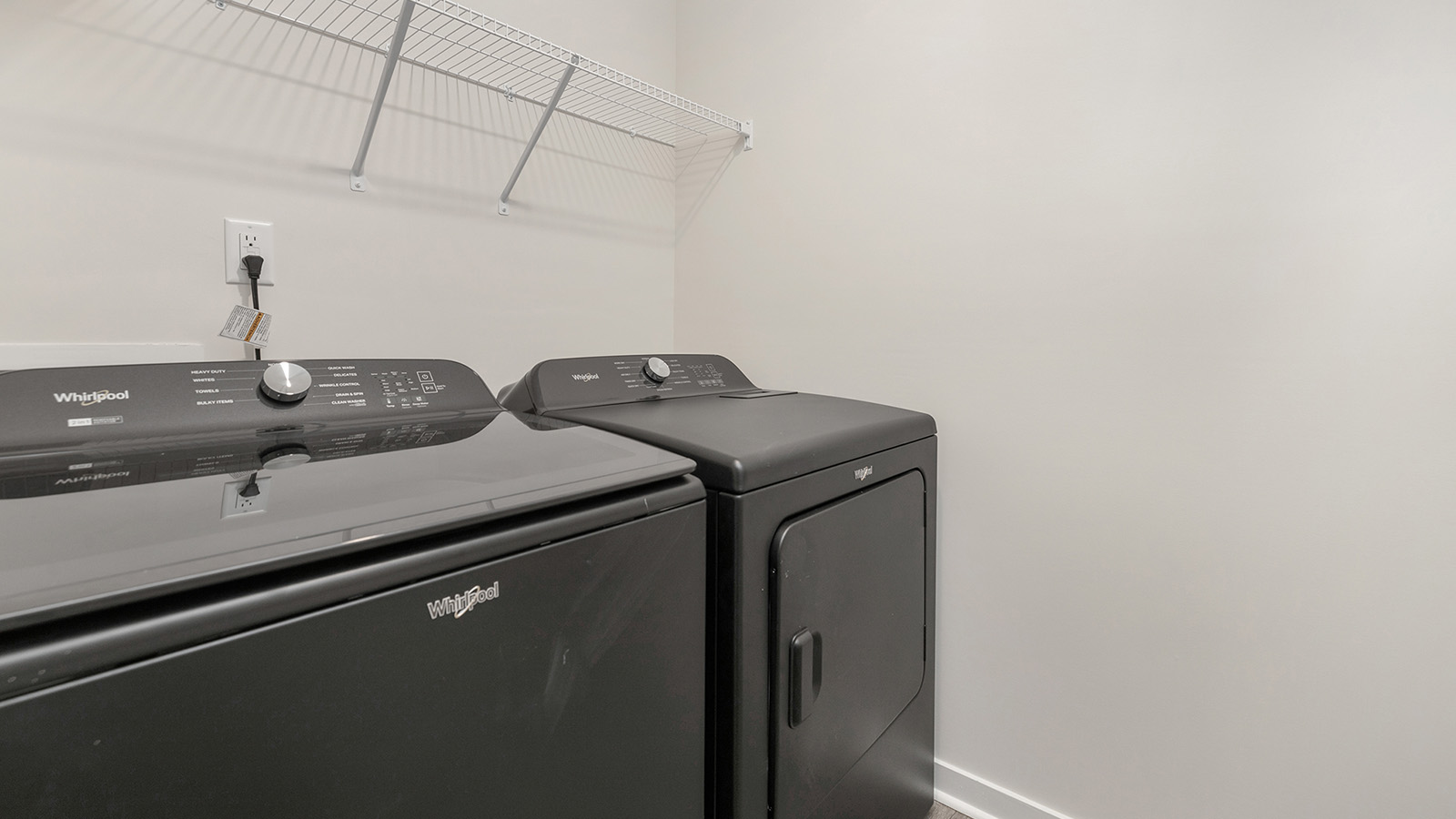 Laundry room with washer, dryer and shelving