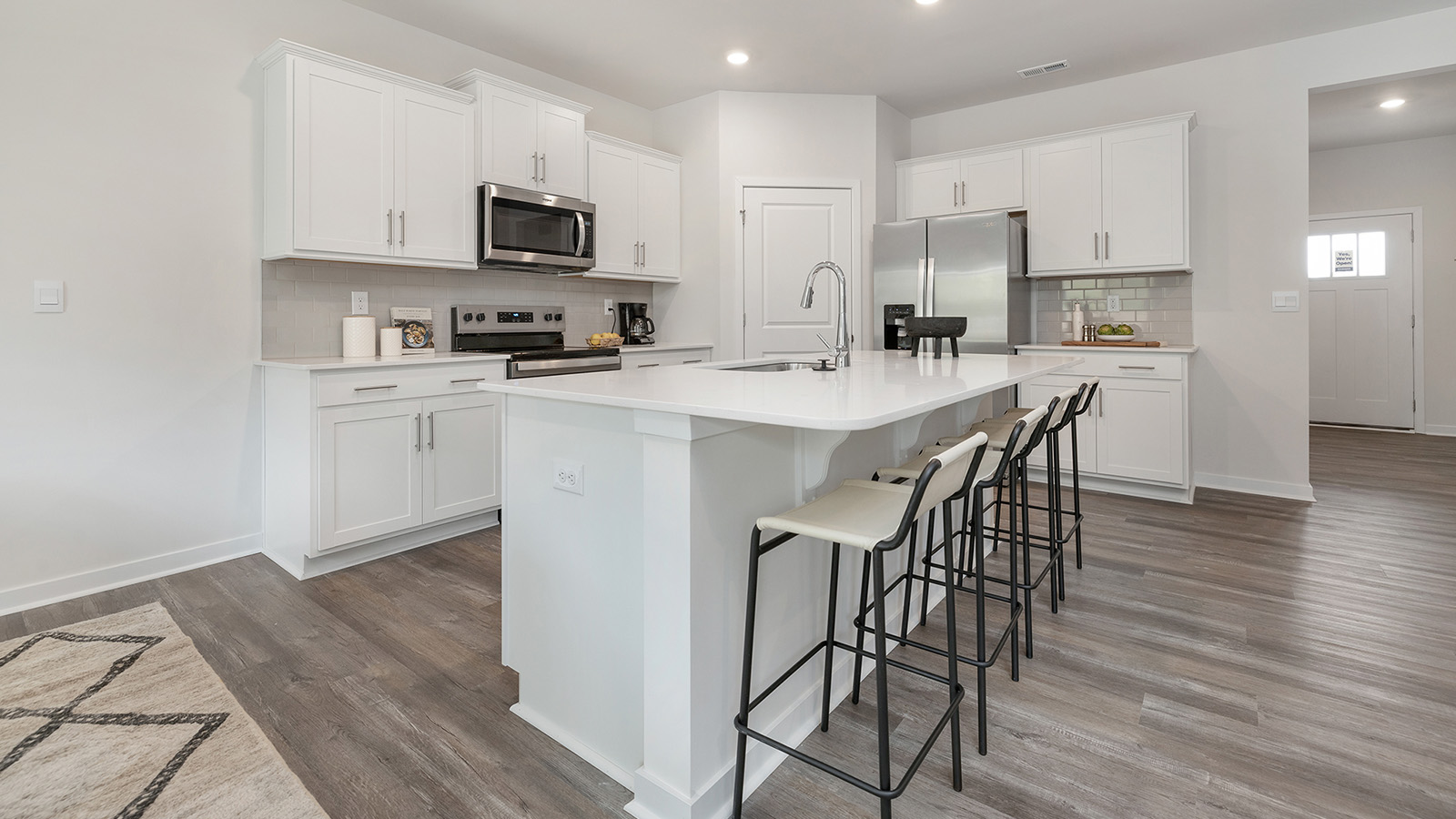 Open concept kitchen with large island and stainless steel