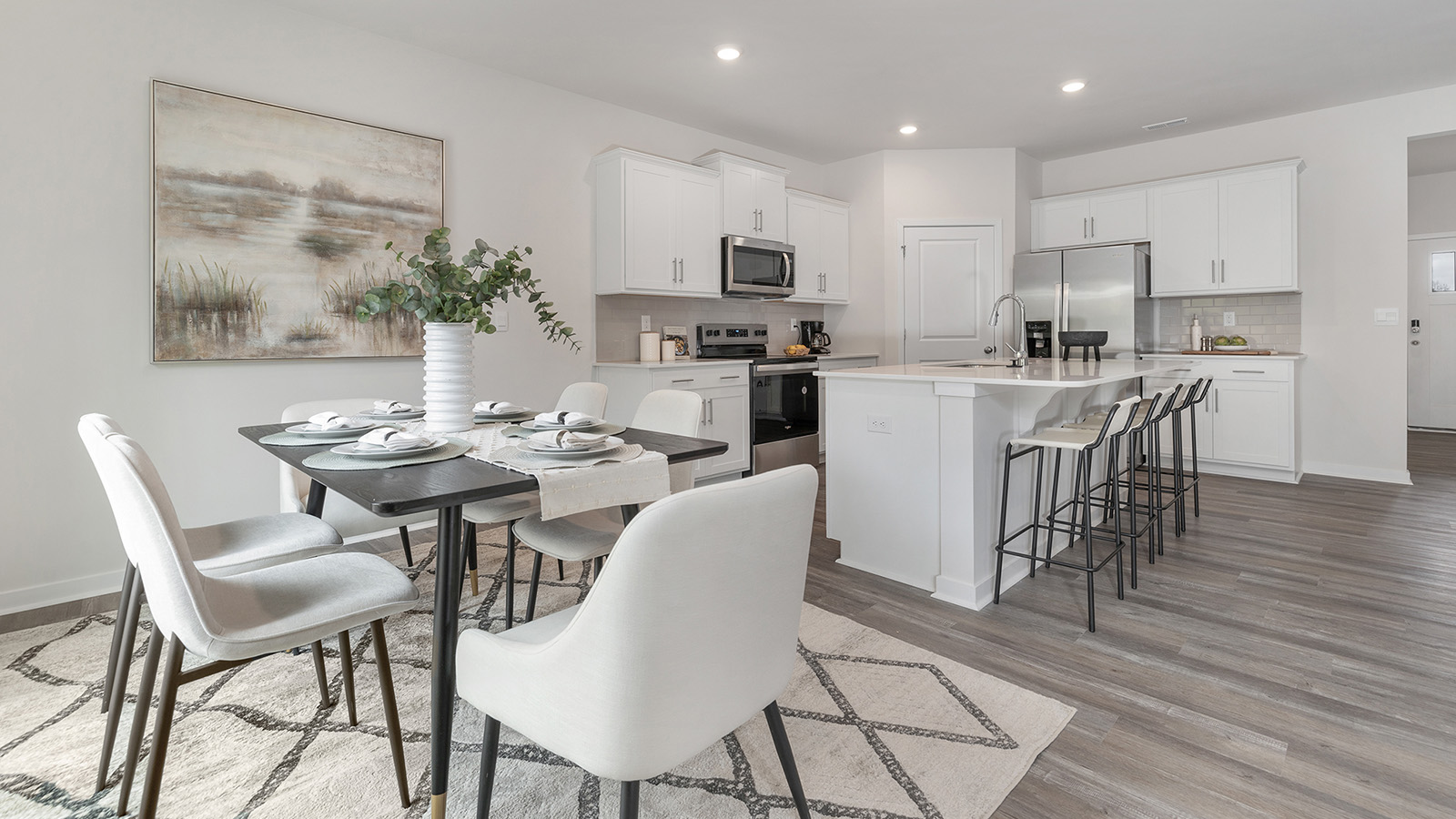 Open dining area with sliding glass doors to patio