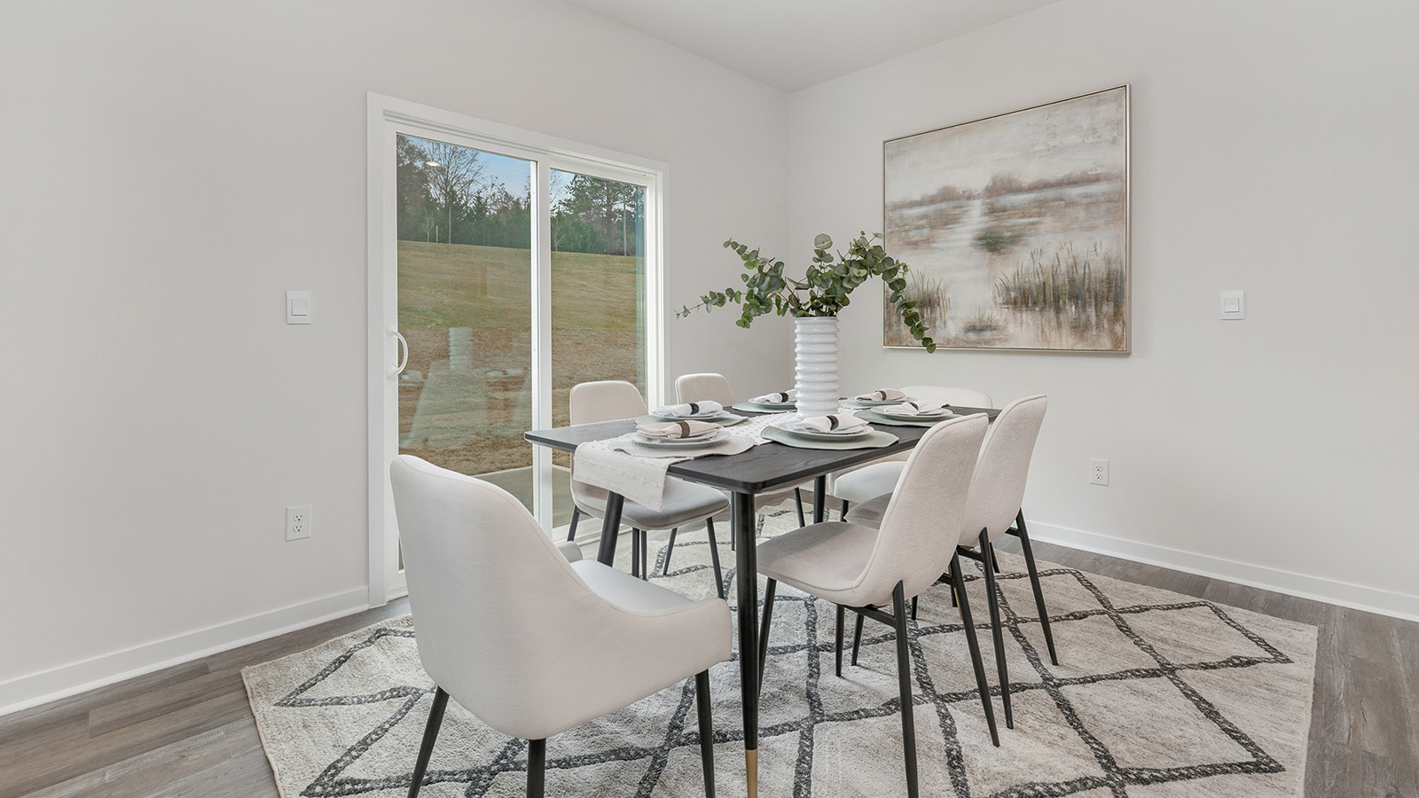 Open dining area with sliding glass doors to patio