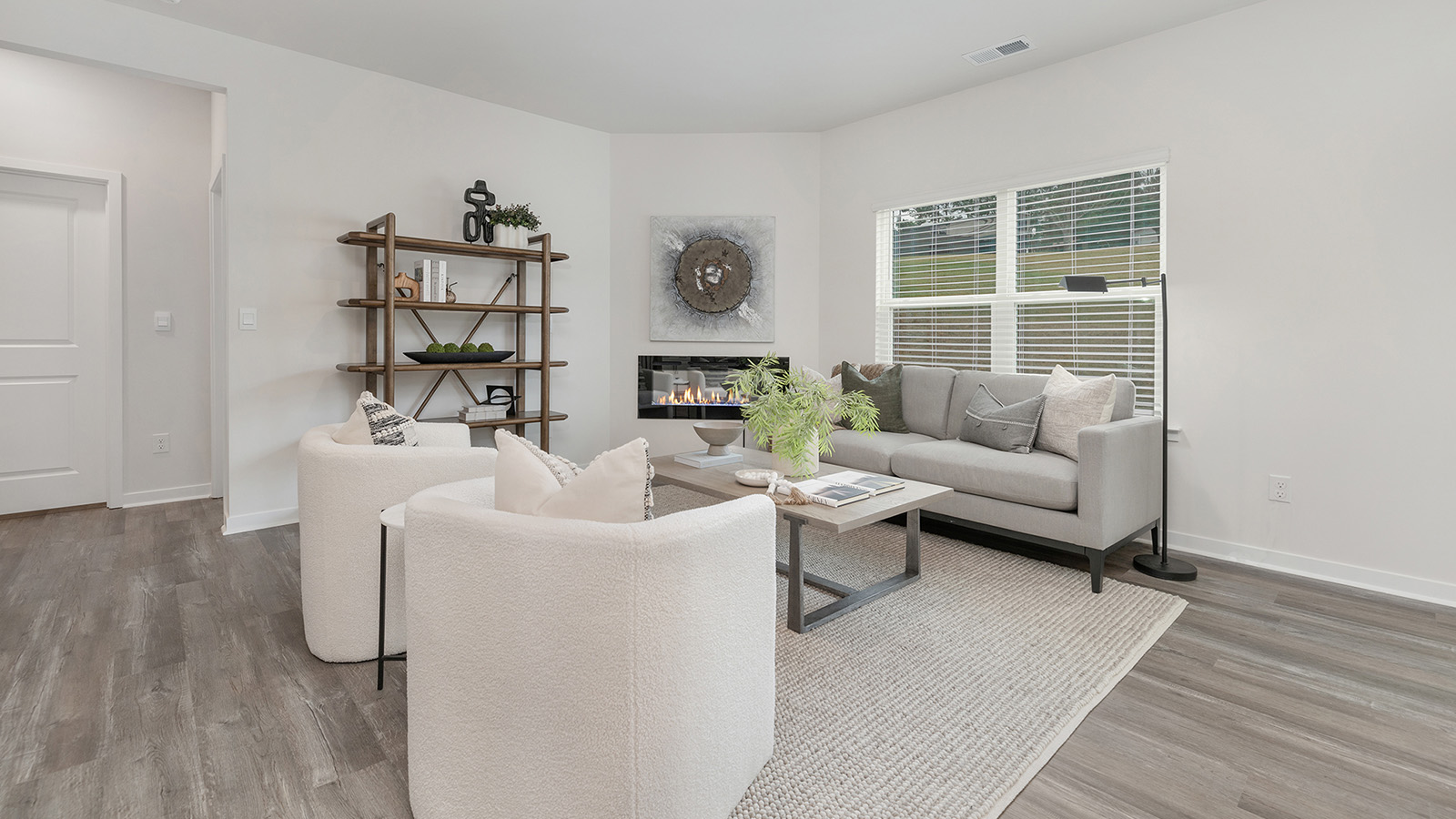 Open concept living area with electric fireplace