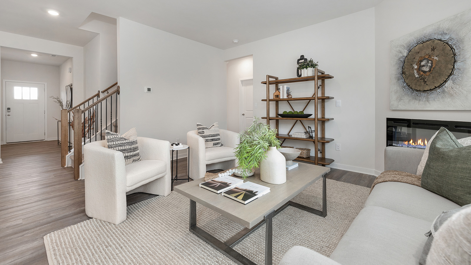 Open concept living area with electric fireplace
