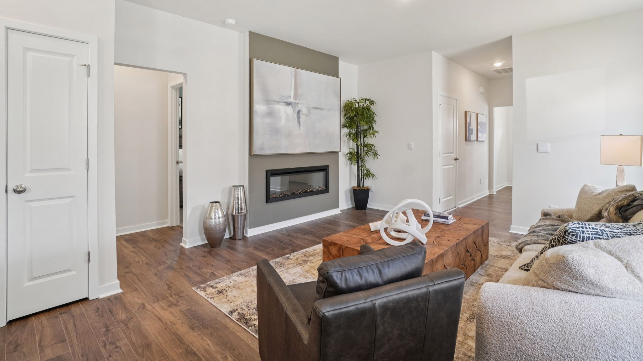 Open concept living area with electric fireplace