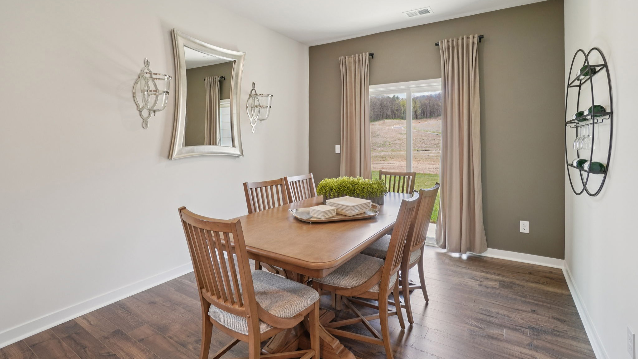Open dining area with sliding glass doors to back patio