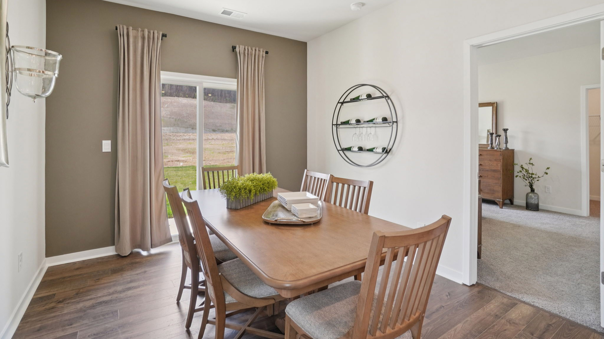 Open dining area with sliding glass doors to back patio
