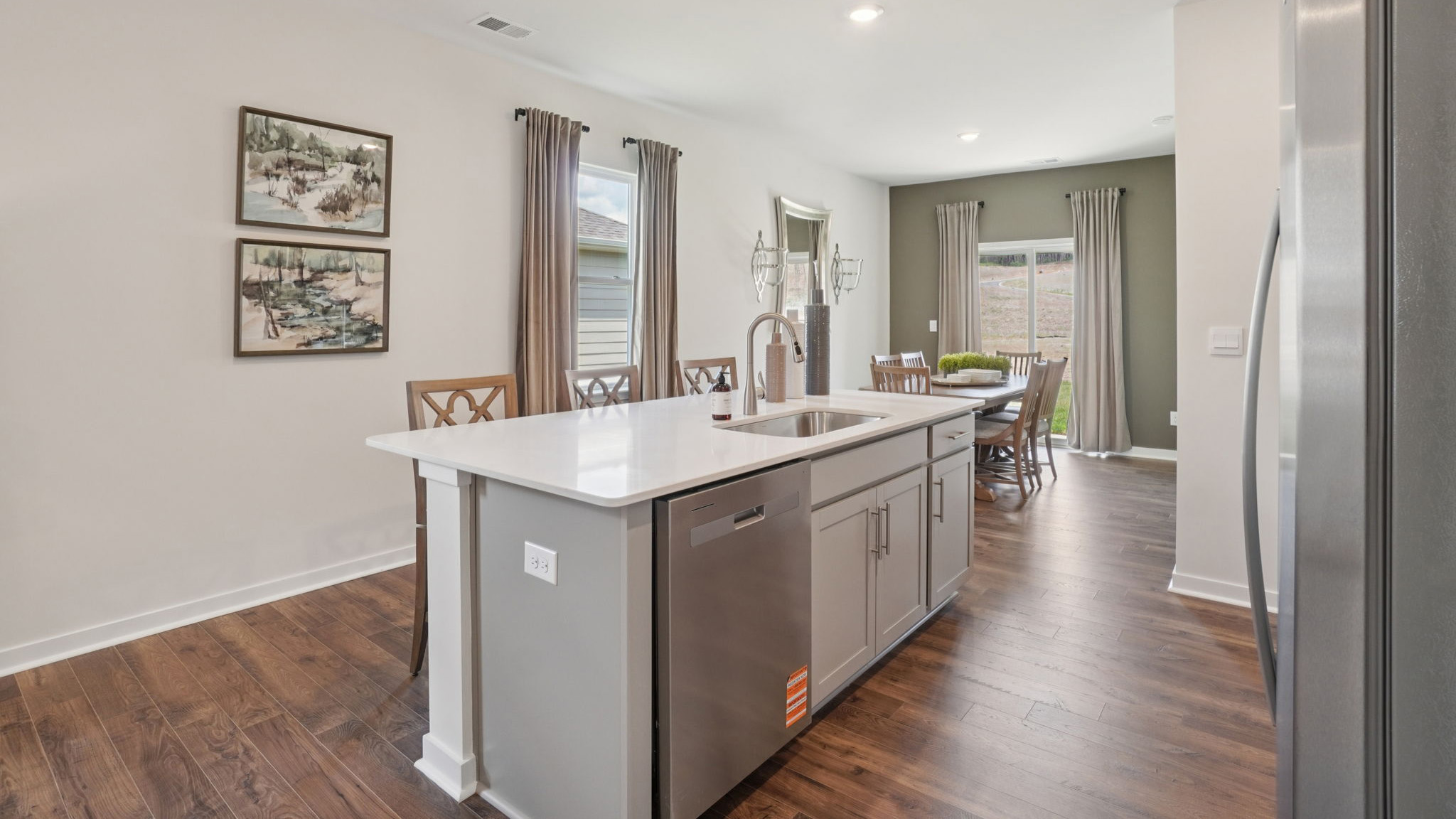 Open dining area with sliding glass doors to back patio