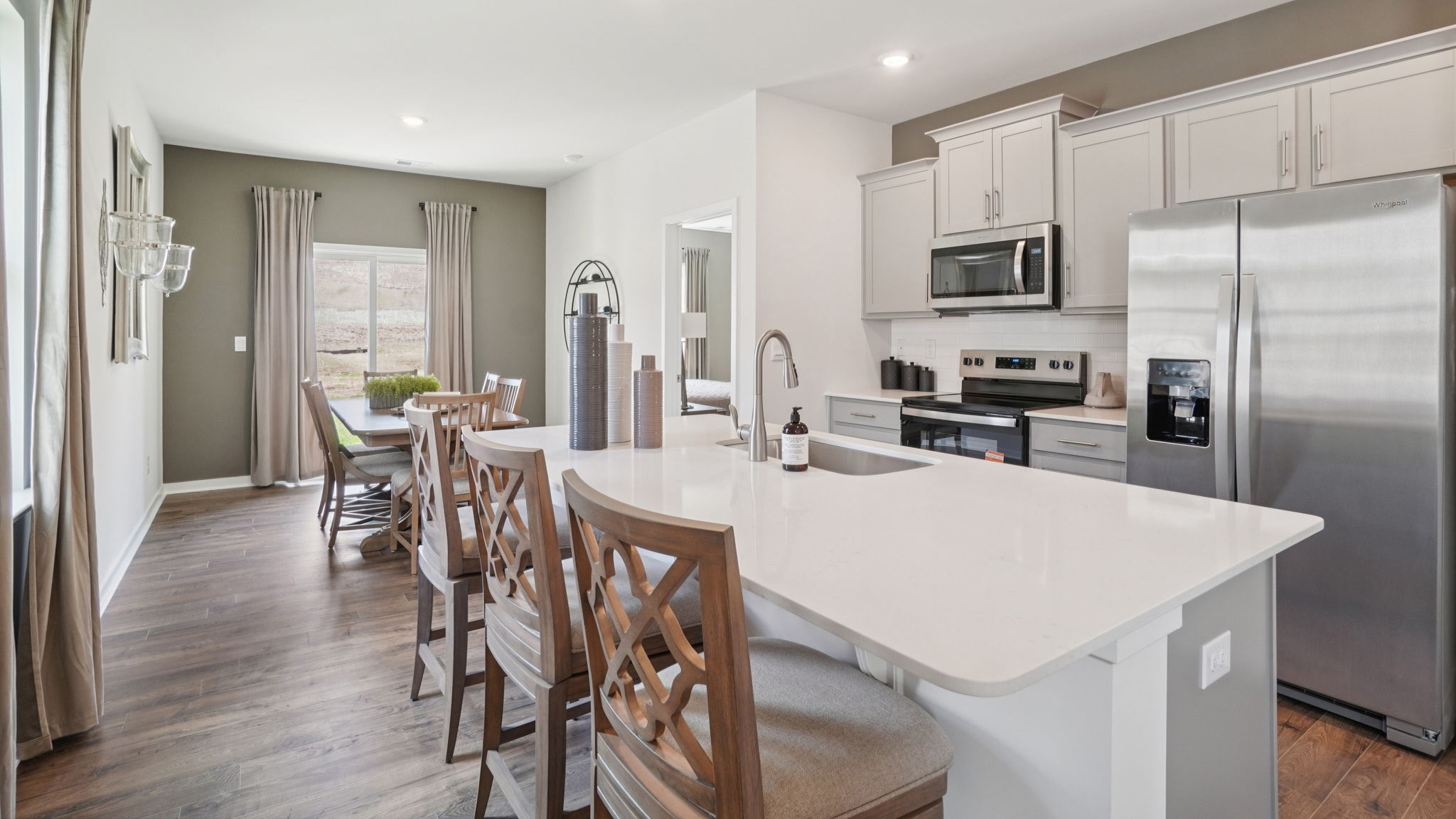 Open kitchen with large island and stainless steel appliances