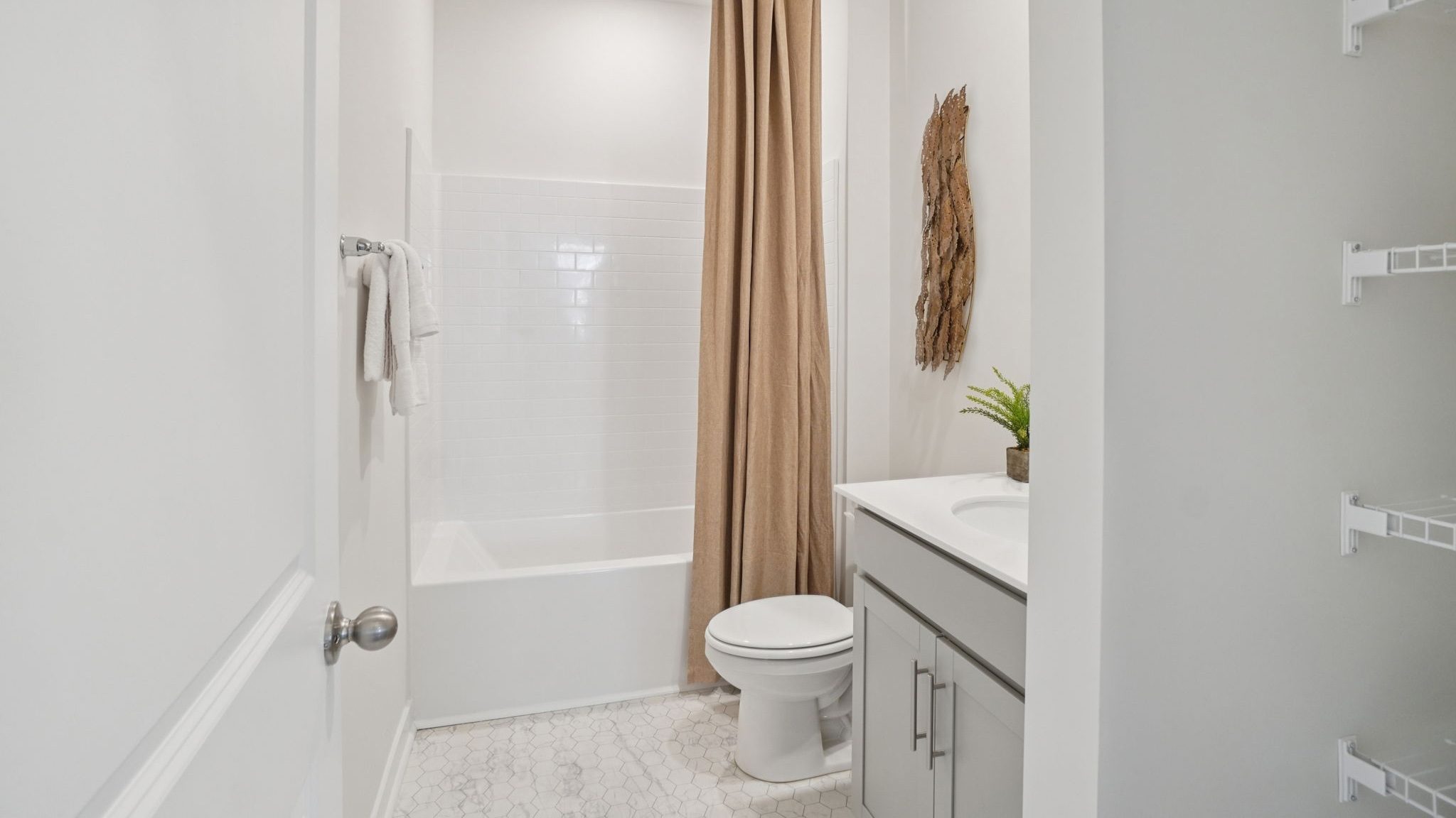Bathroom with single vanity and bathtub