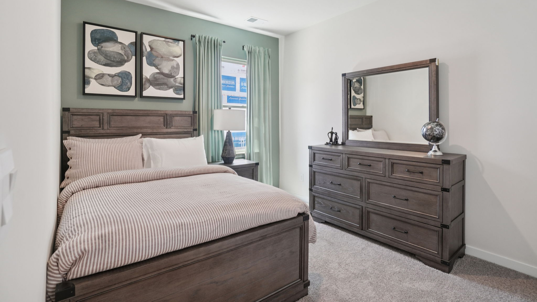 Carpeted bedroom with large window