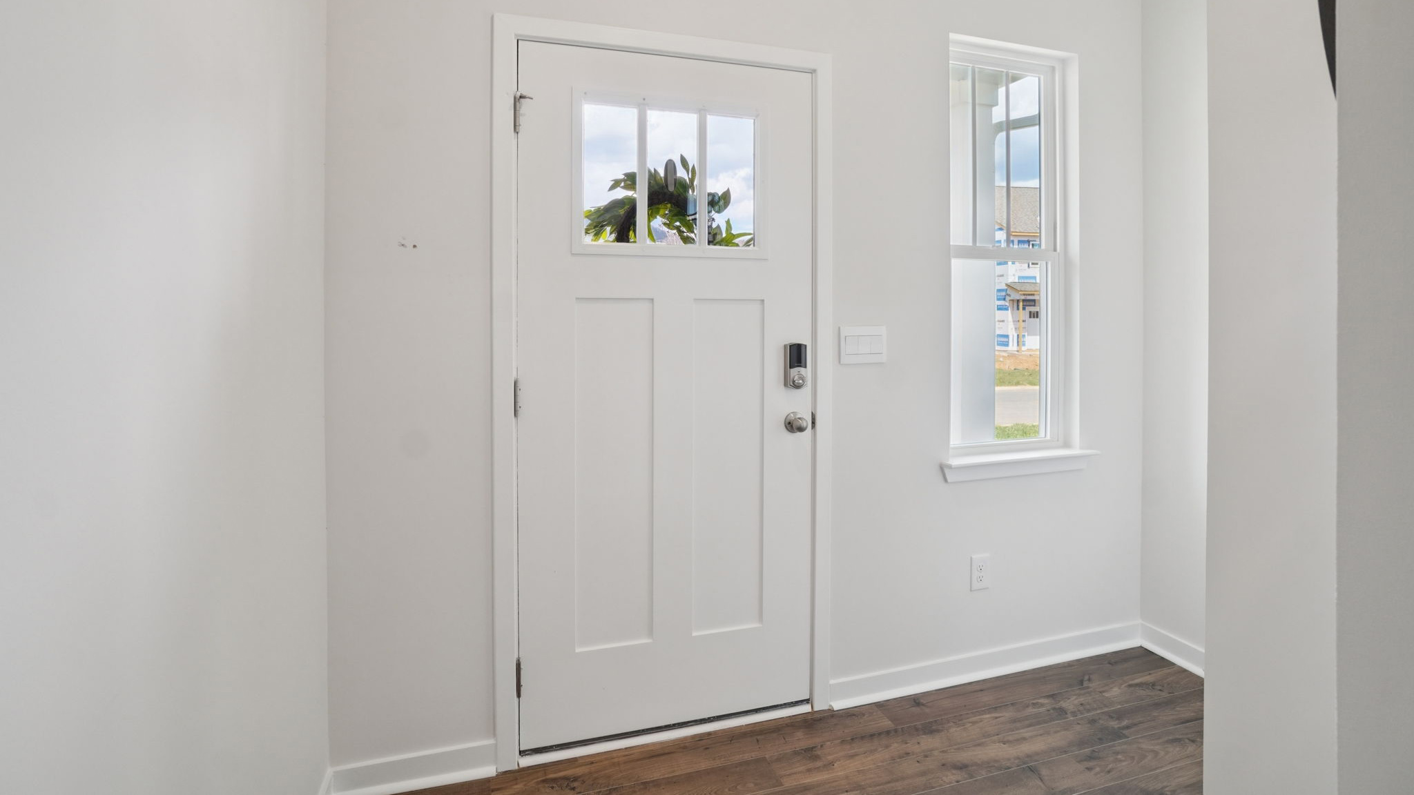 Welcoming foyer with large coat closet and drop zone